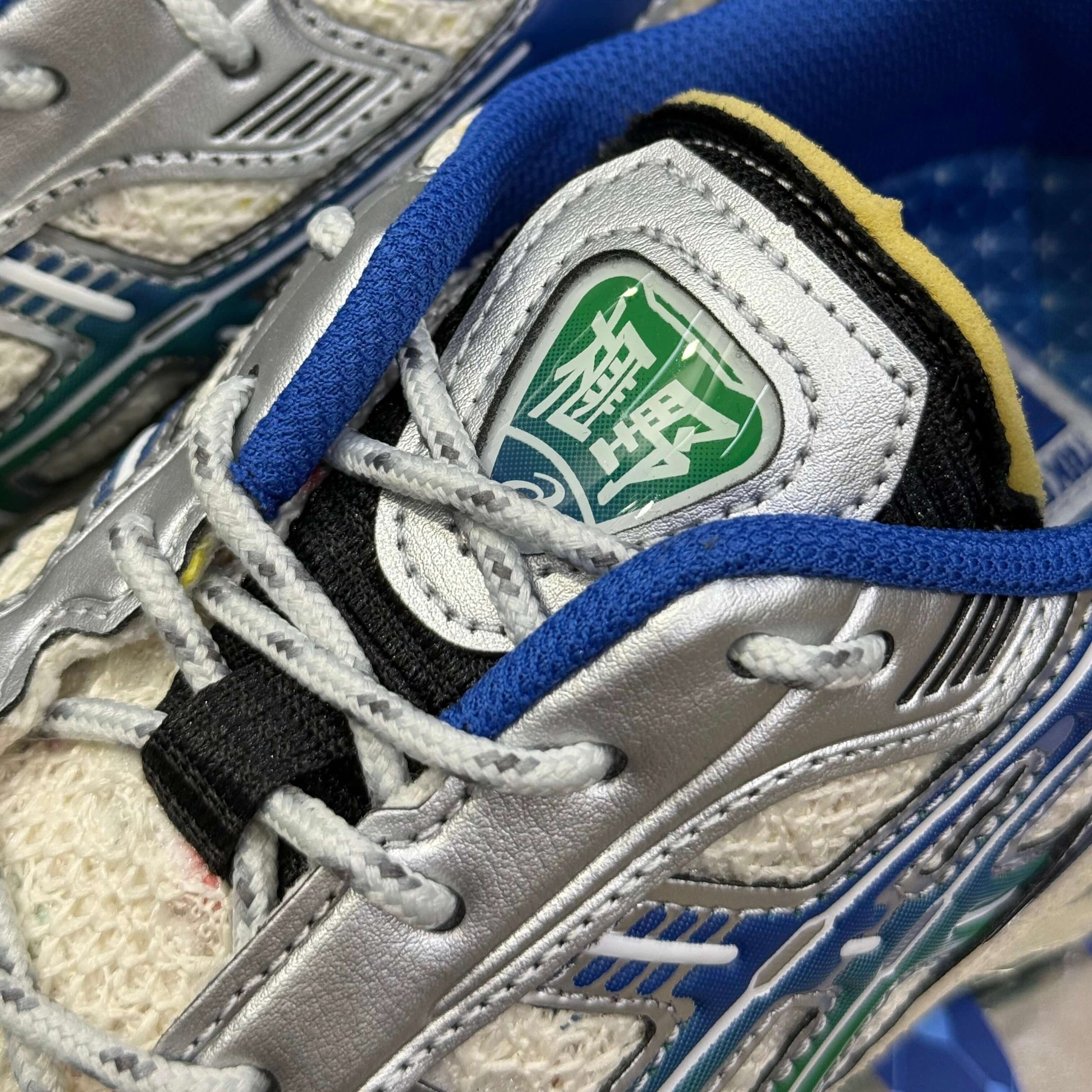 Close-up of the Carnival x Asics Gel Kayano 12.1 PHRA NAKHON sneaker showcasing its unique design and logo.