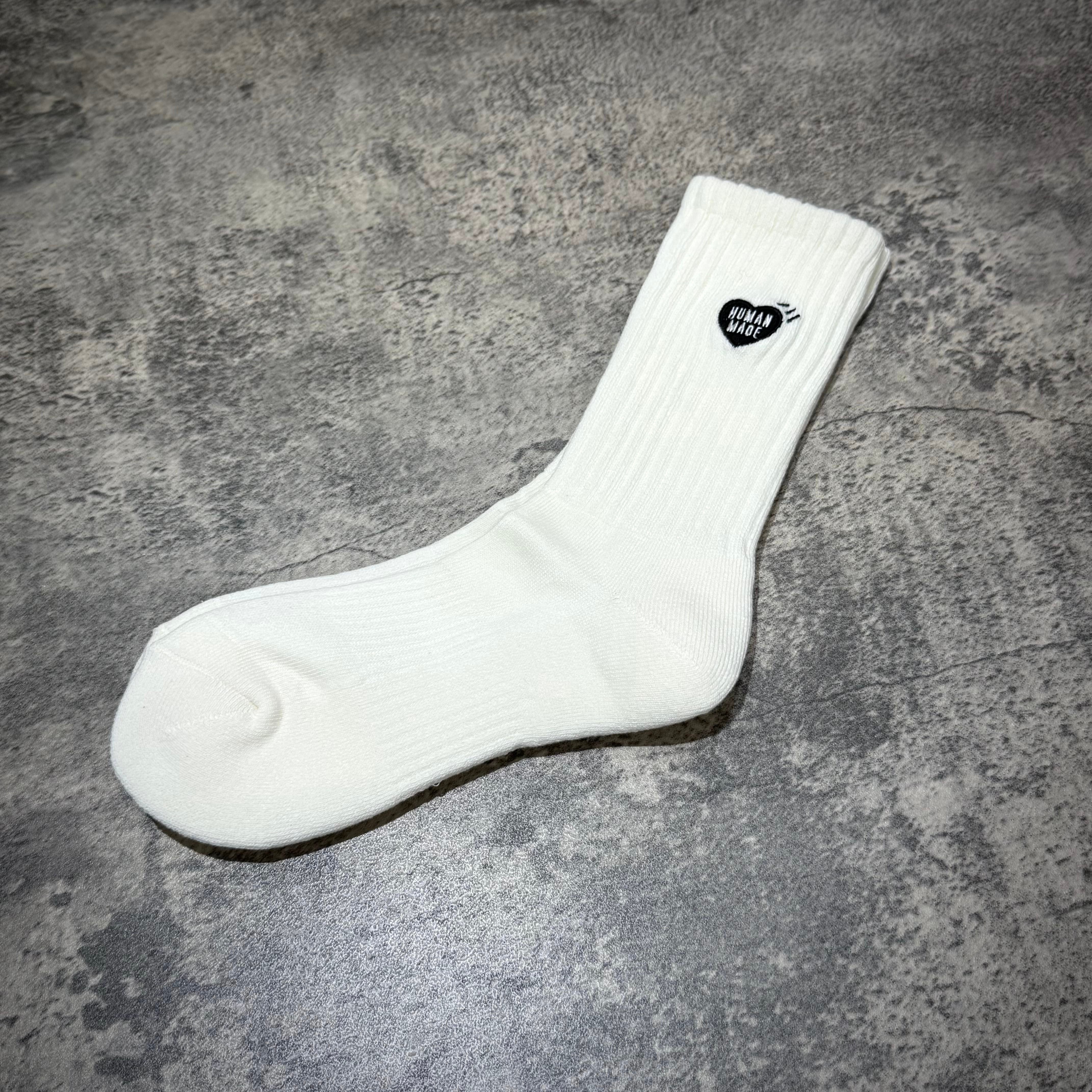 Human Made Pile Socks in white with a heart logo, perfect for casual wear and comfort.