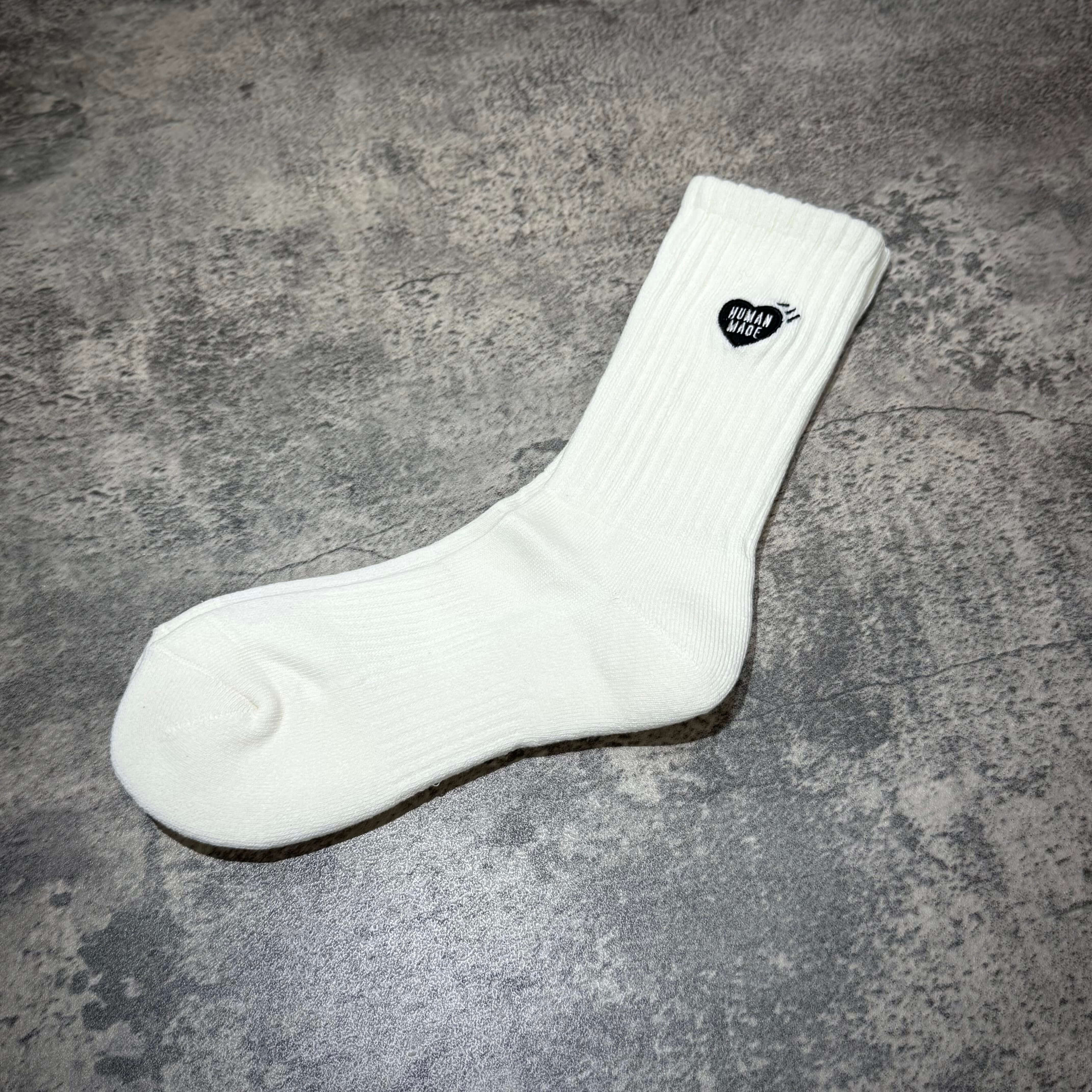 Human Made Pile Socks in white with a heart logo, perfect for casual wear and comfort.