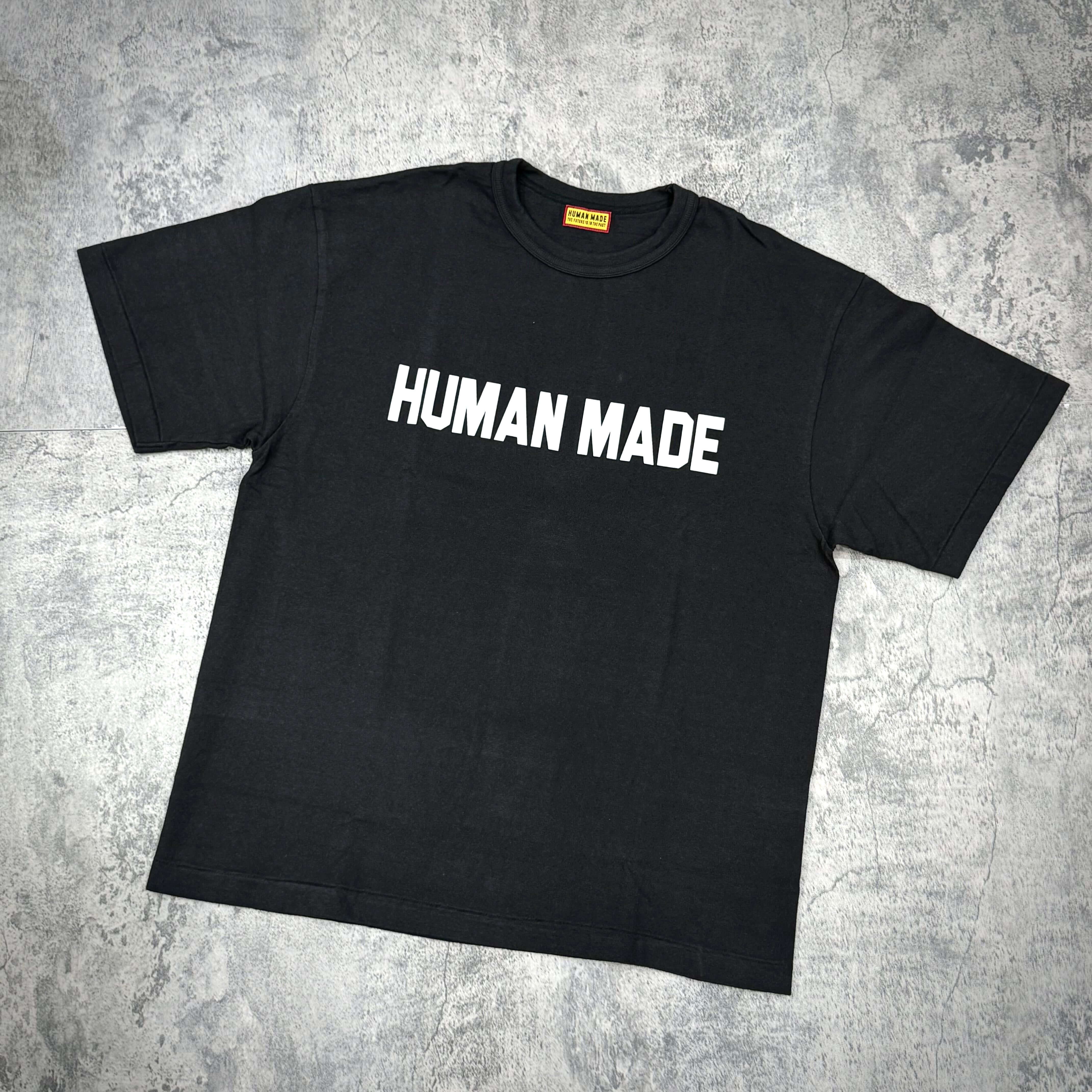 Human Made Graphic Tee HM31TE012 in black color with bold white lettering.