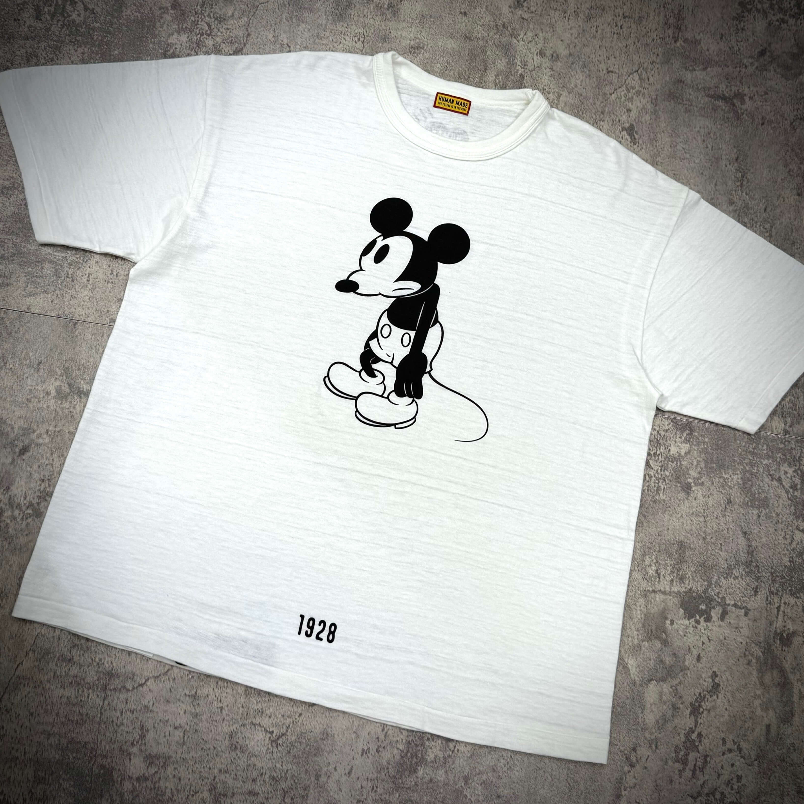 Human Made 1928 Disney Mickey Graphic Tee featuring classic Mickey Mouse design in black on white fabric.
