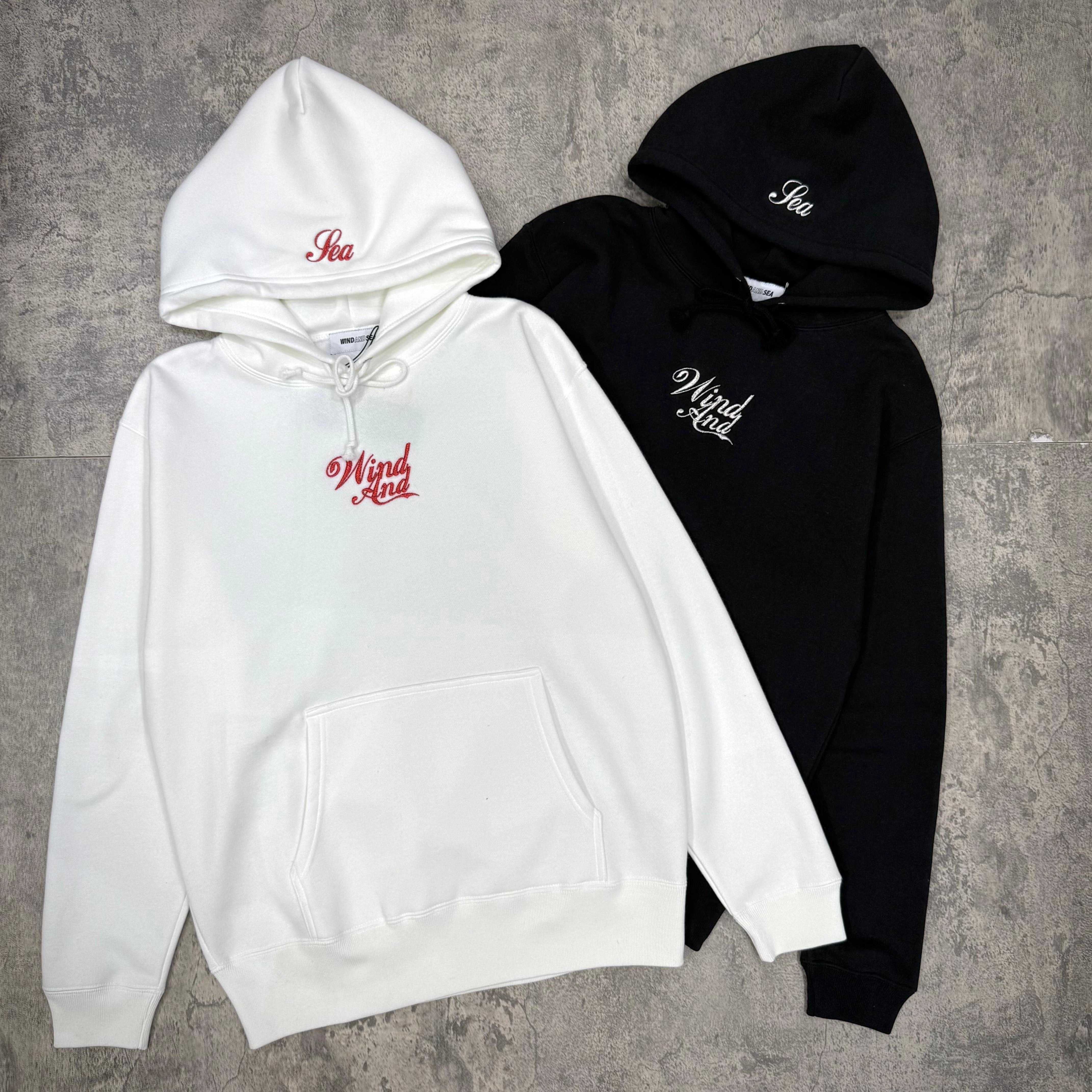 Wind And Sea Glitter Hoodie - Black / White displayed together with logo design on each.