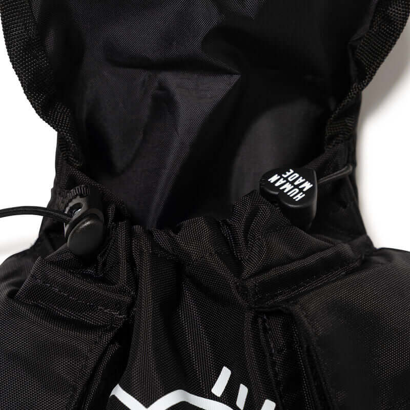 Close-up of the Human Made Military Multi Pouch showing the drawstring and interior details.