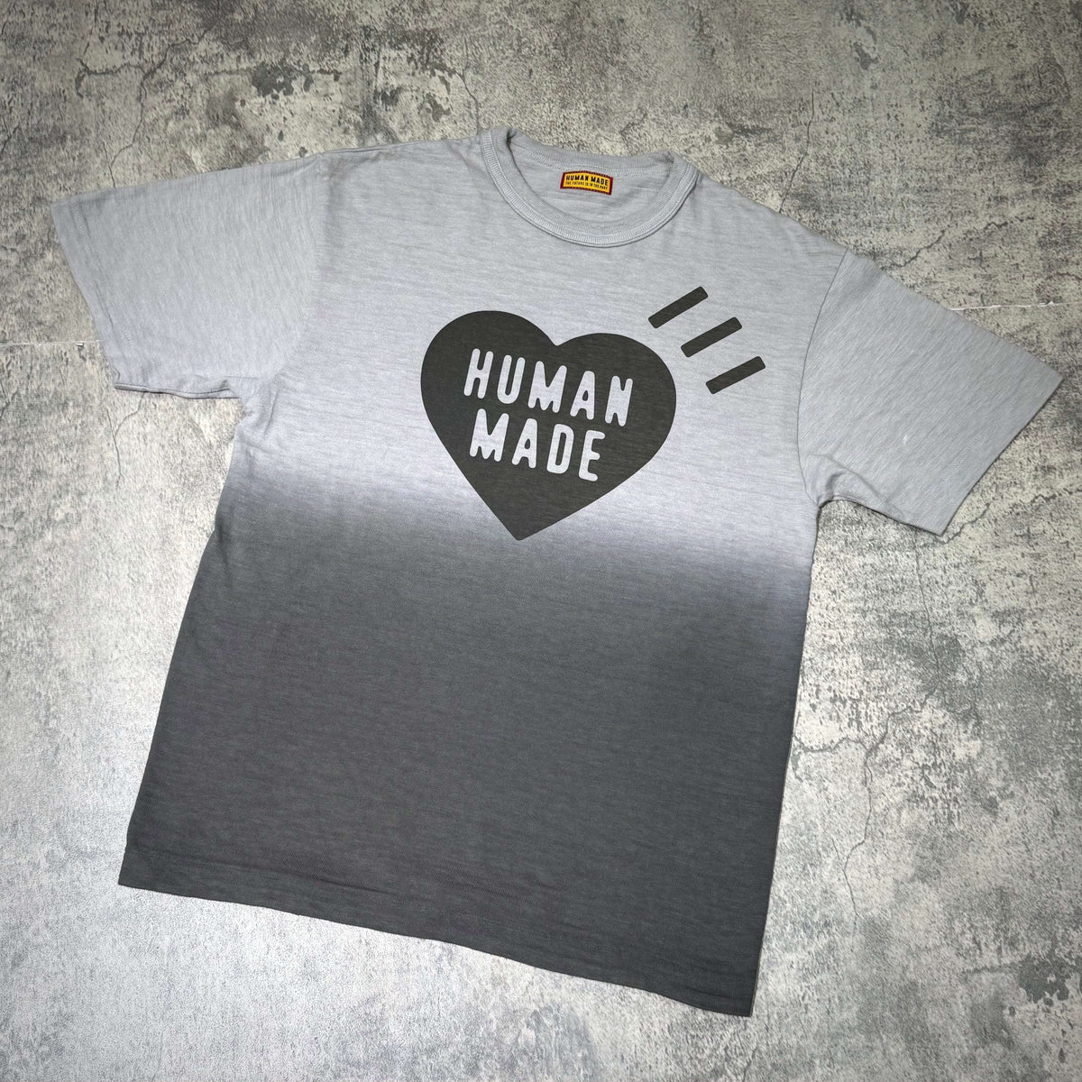 Human Made Tokyo Exclusive Gradation Tee featuring a heart design in black and a gray ombre effect.