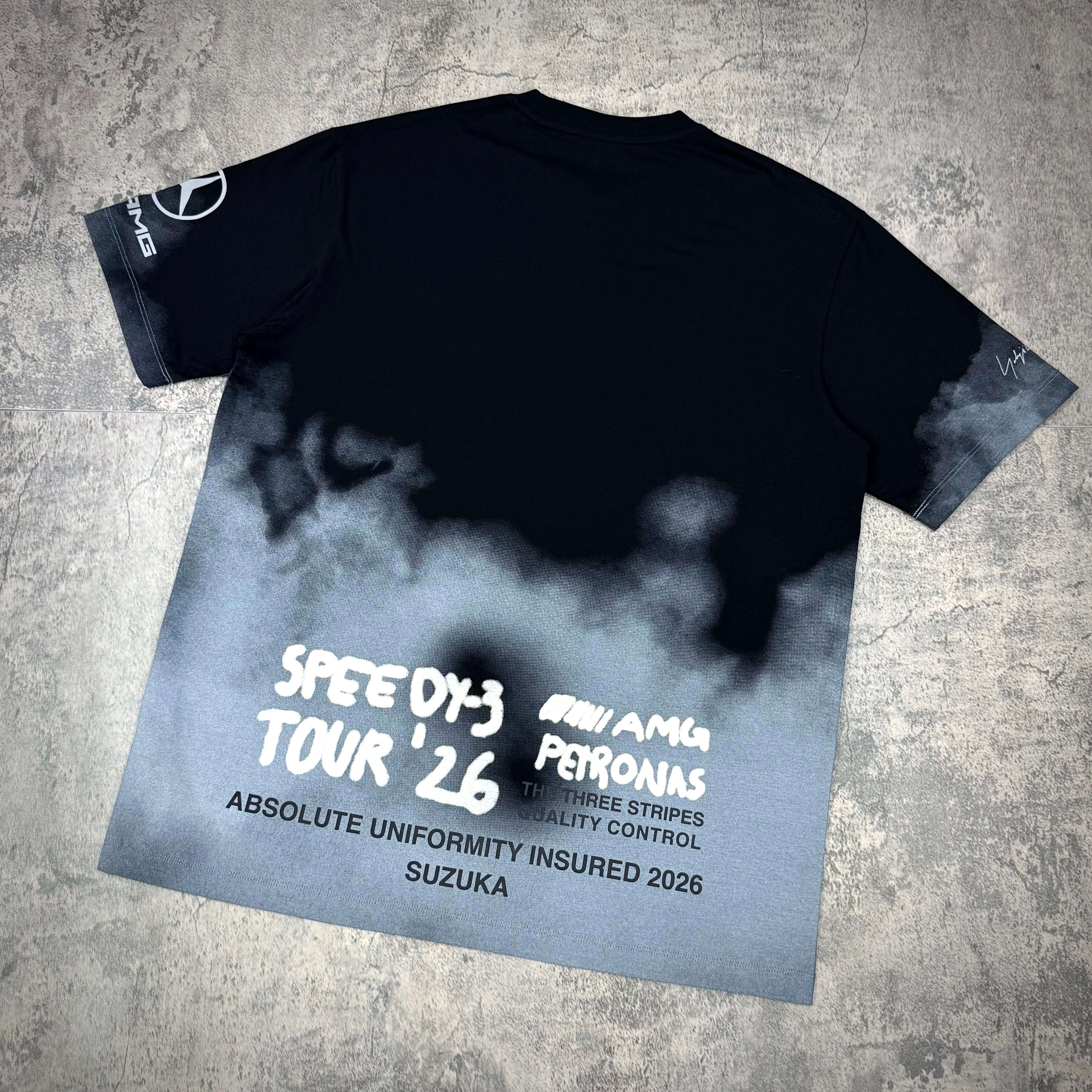 Y-3 x Mercedes AMG Petronas F1 Tour Tee featuring a stylish design with fading colors and bold lettering on the back.