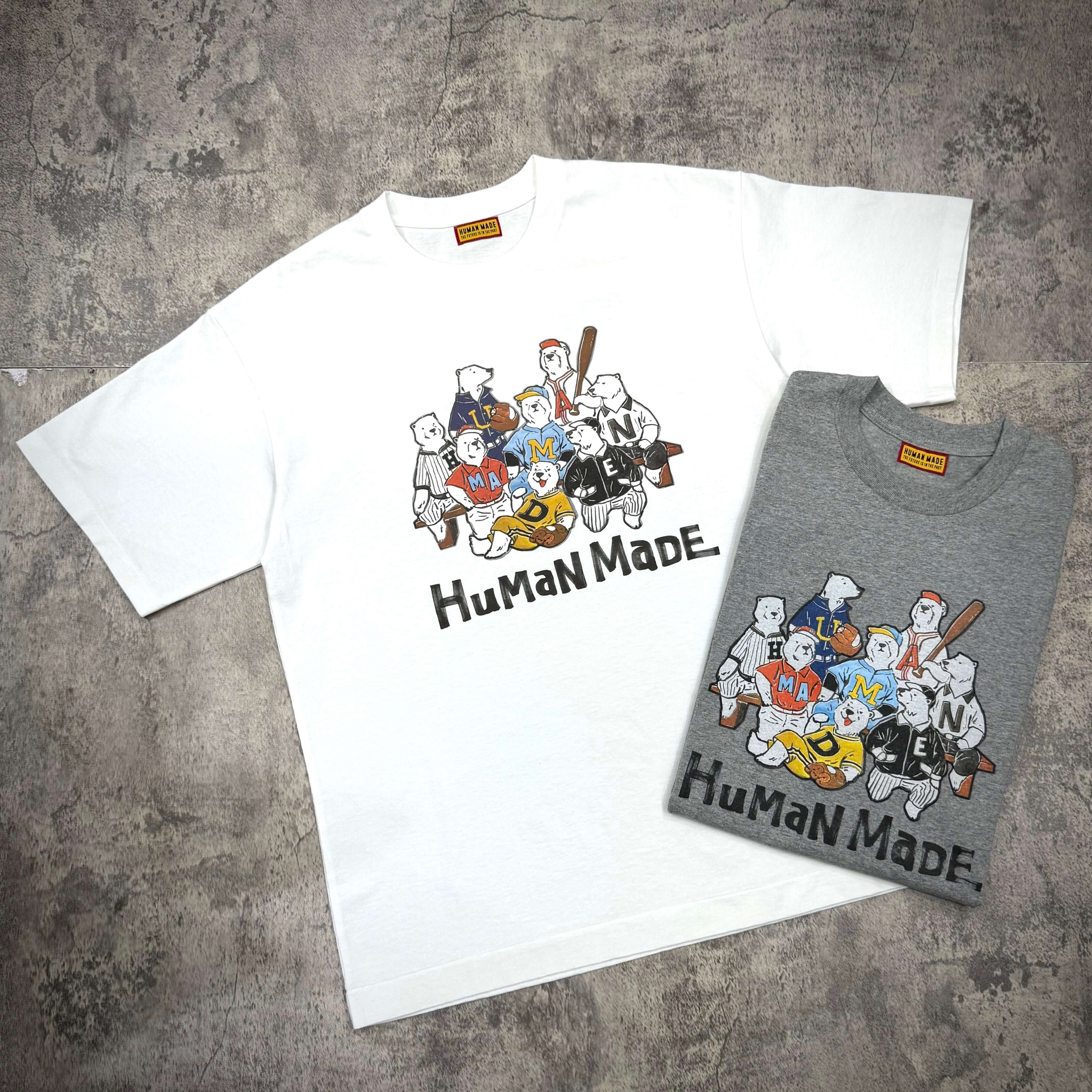 Human Made Graphic Tee HM31CS009 in white and gray, featuring unique graphic design on both shirts.