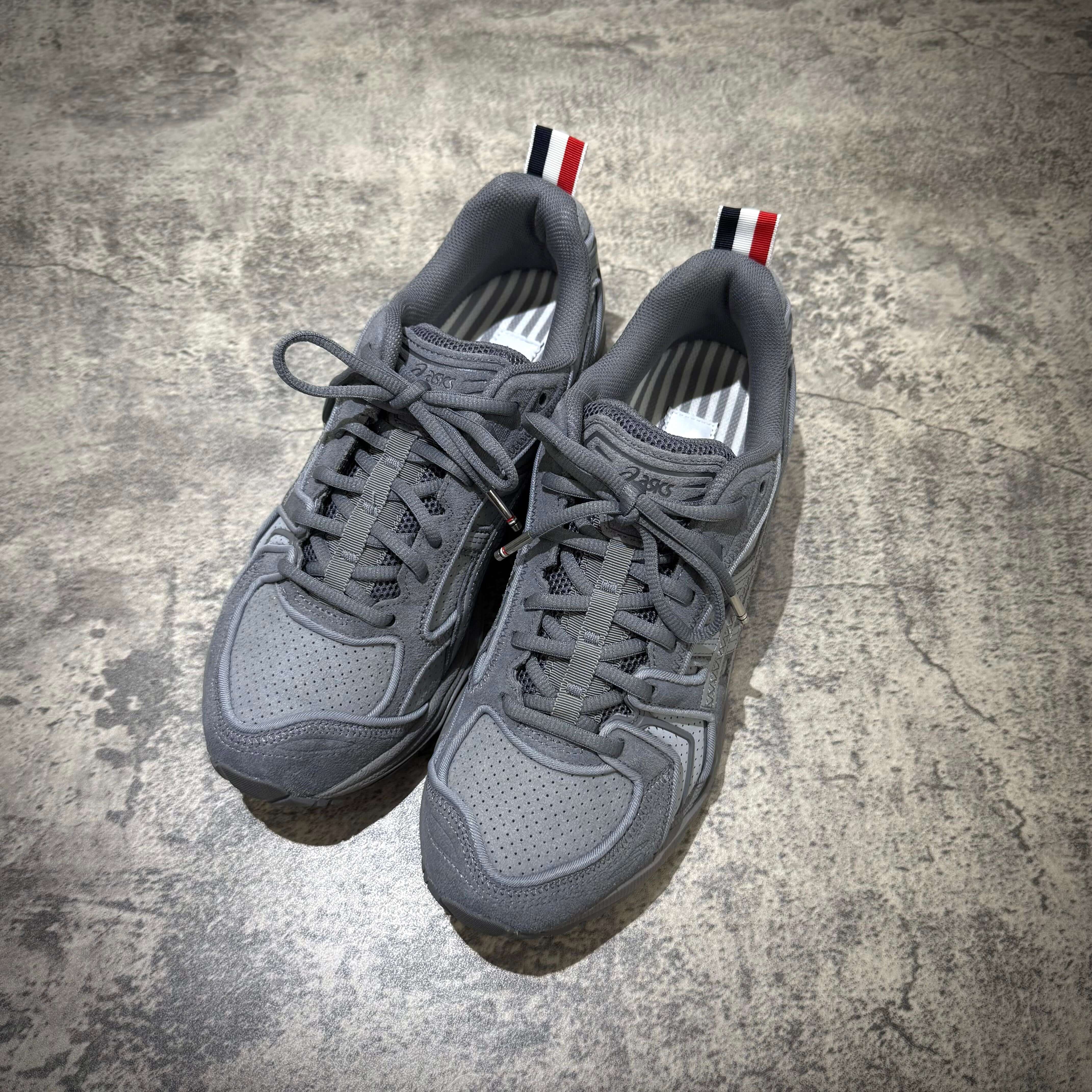 Thom Browne x Asics Gel-Kayano 14 in Grey top view, featuring sleek design and signature branding.