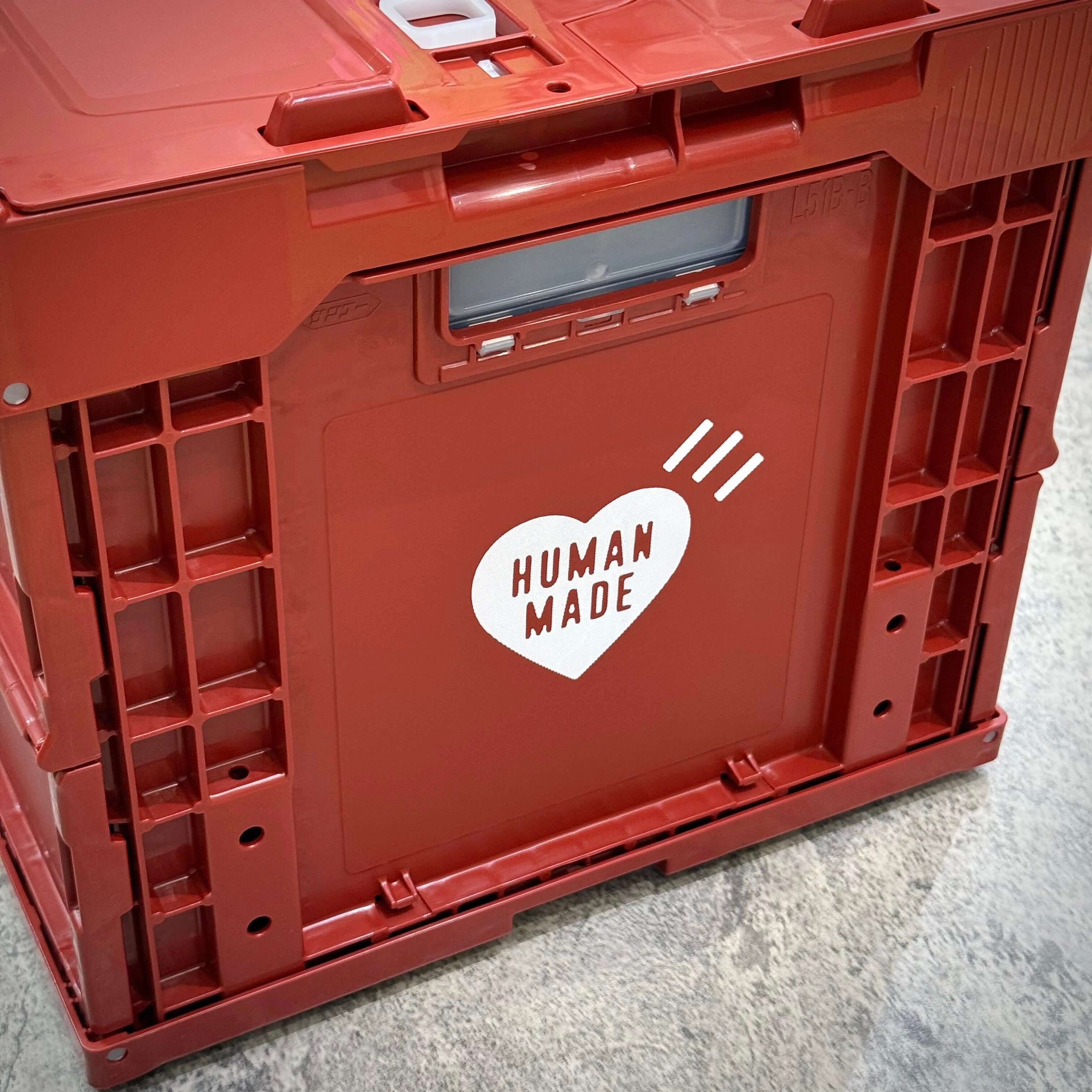 Human Made Container with a heart logo design on a red plastic crate.