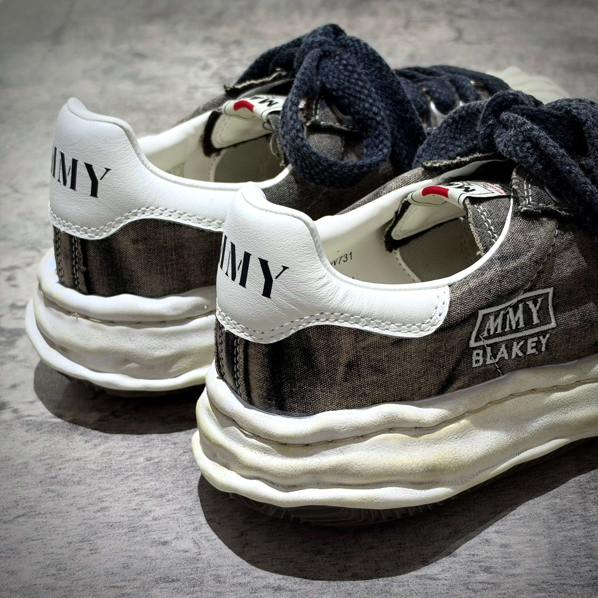 MMY Blakey Bleached Canvas Low - Black showing the back view of stylish low-top sneakers.