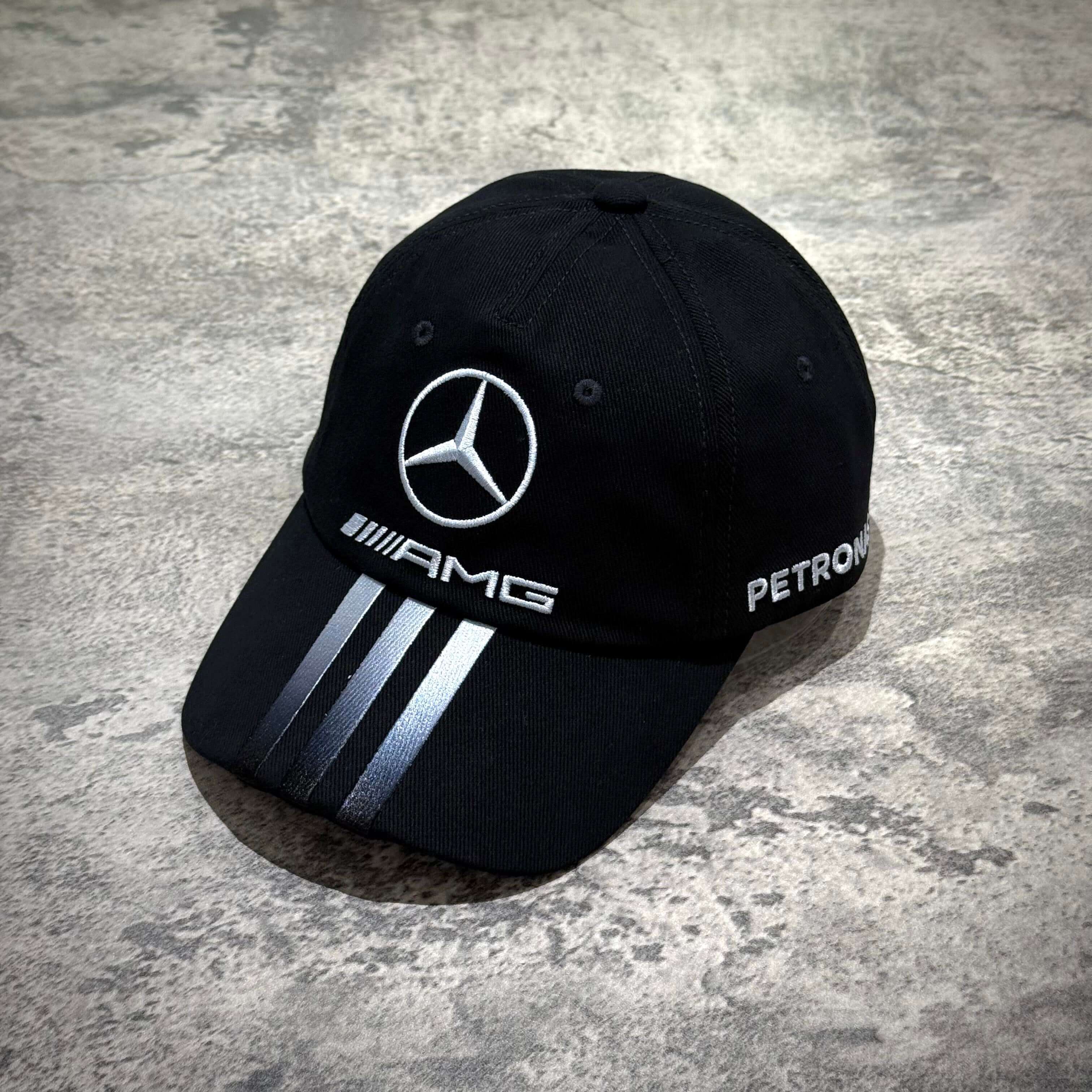 Y-3 x Mercedes AMG Petronas F1 Dad Cap featuring iconic logo and stripes on a stylish black design.