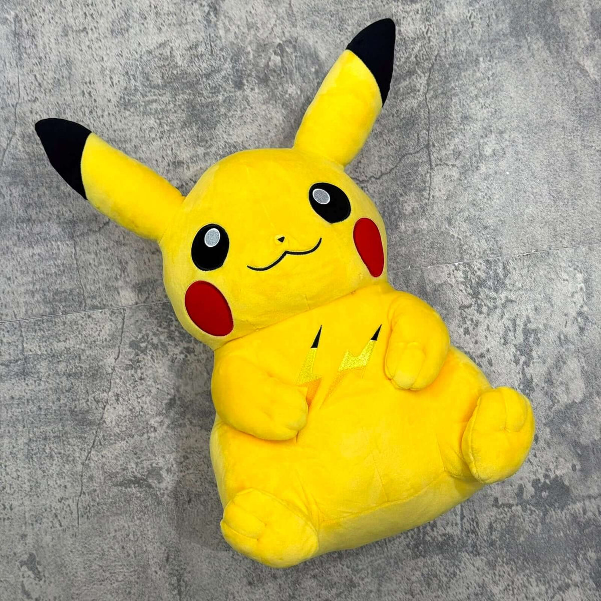 Pokemon x Thunderbolt Project by Fragment Pikachu Plush on a textured background