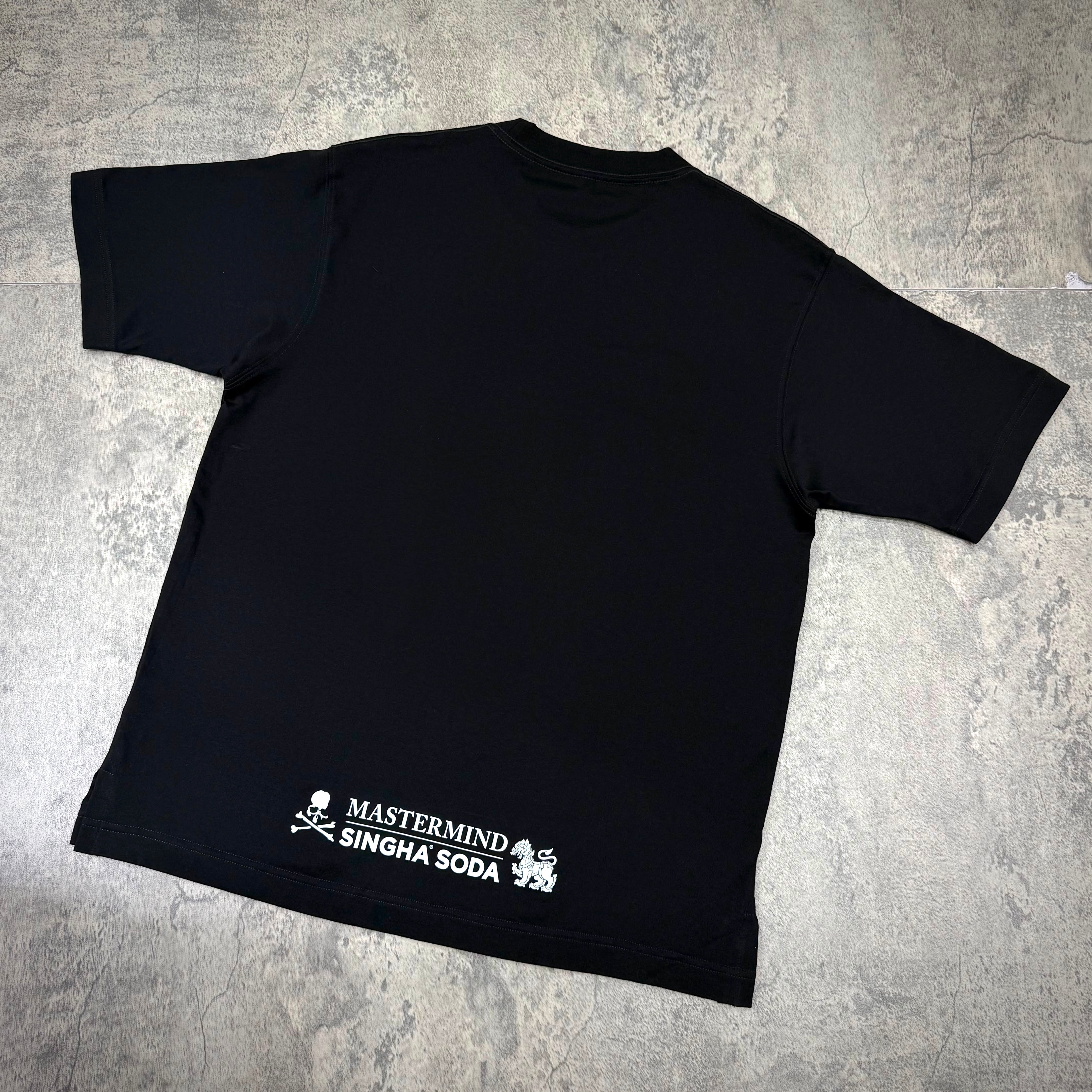 Singha Soda x Mastermind World SS Tee #2 black t-shirt featuring brand logo on the back.