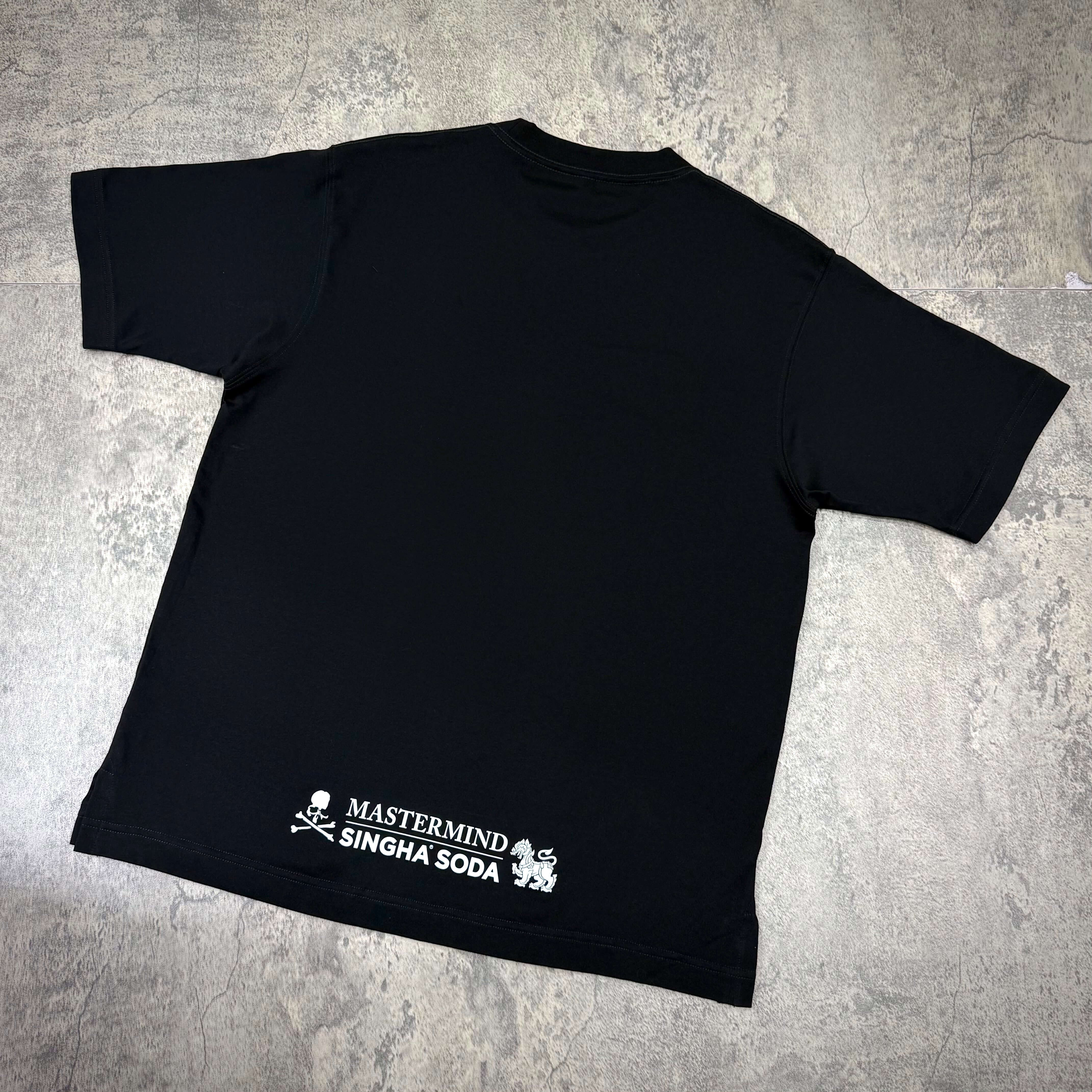 Singha Soda x Mastermind World SS Tee #2 black t-shirt featuring brand logo on the back.