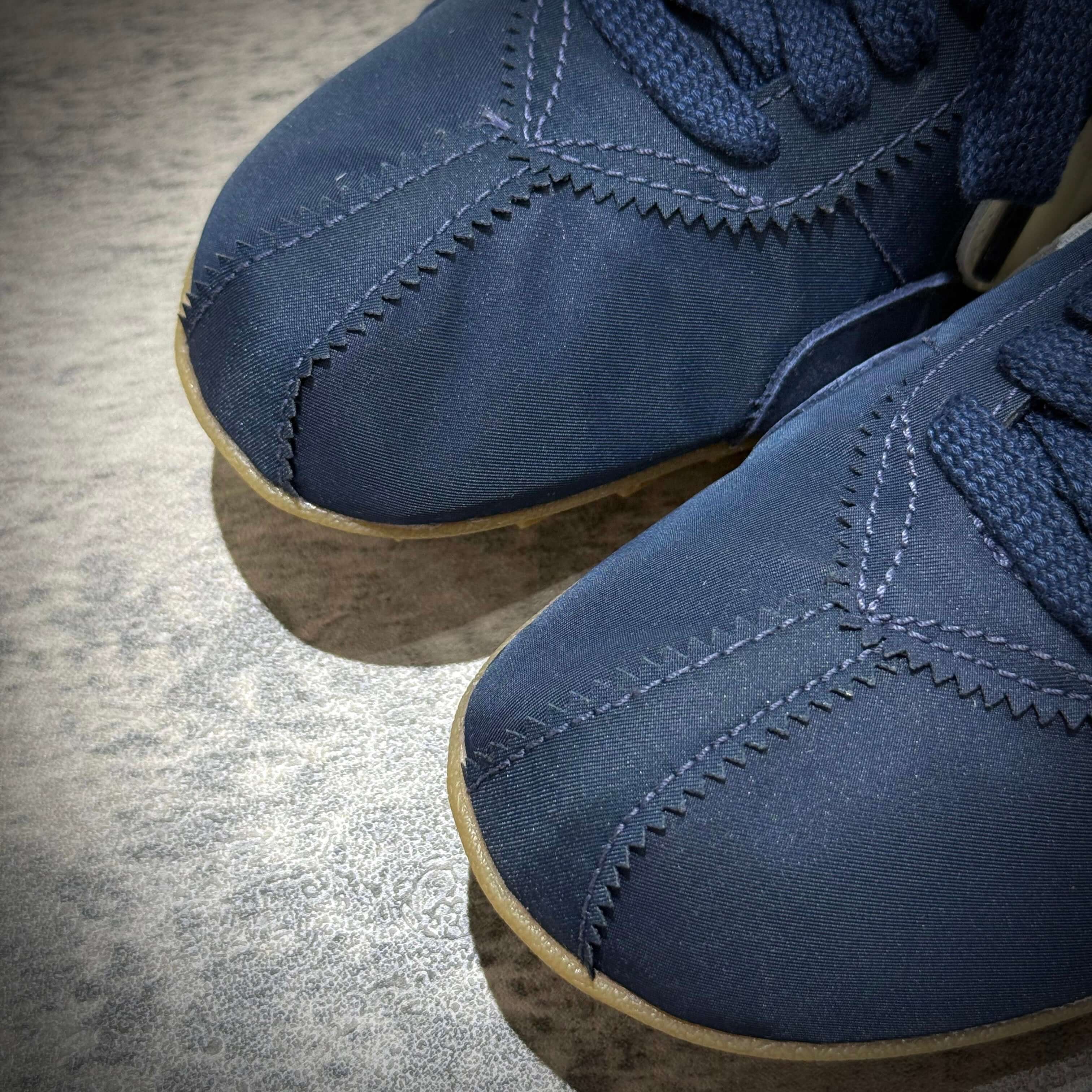 Close-up of Nike Moon Shoe OG in Midnight Navy showcasing detailed stitching and laces on the upper.