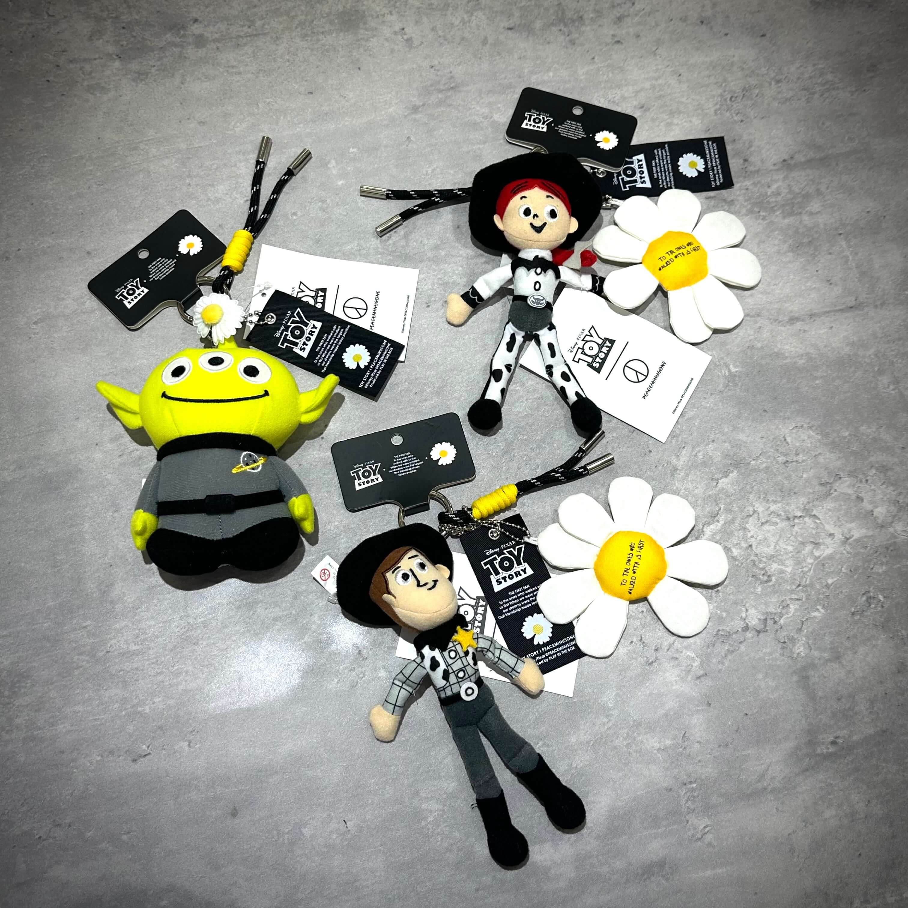 PEACEMINUSONE x Toy Story The First Fan - Plush Key Ring featuring plush characters and flower designs.