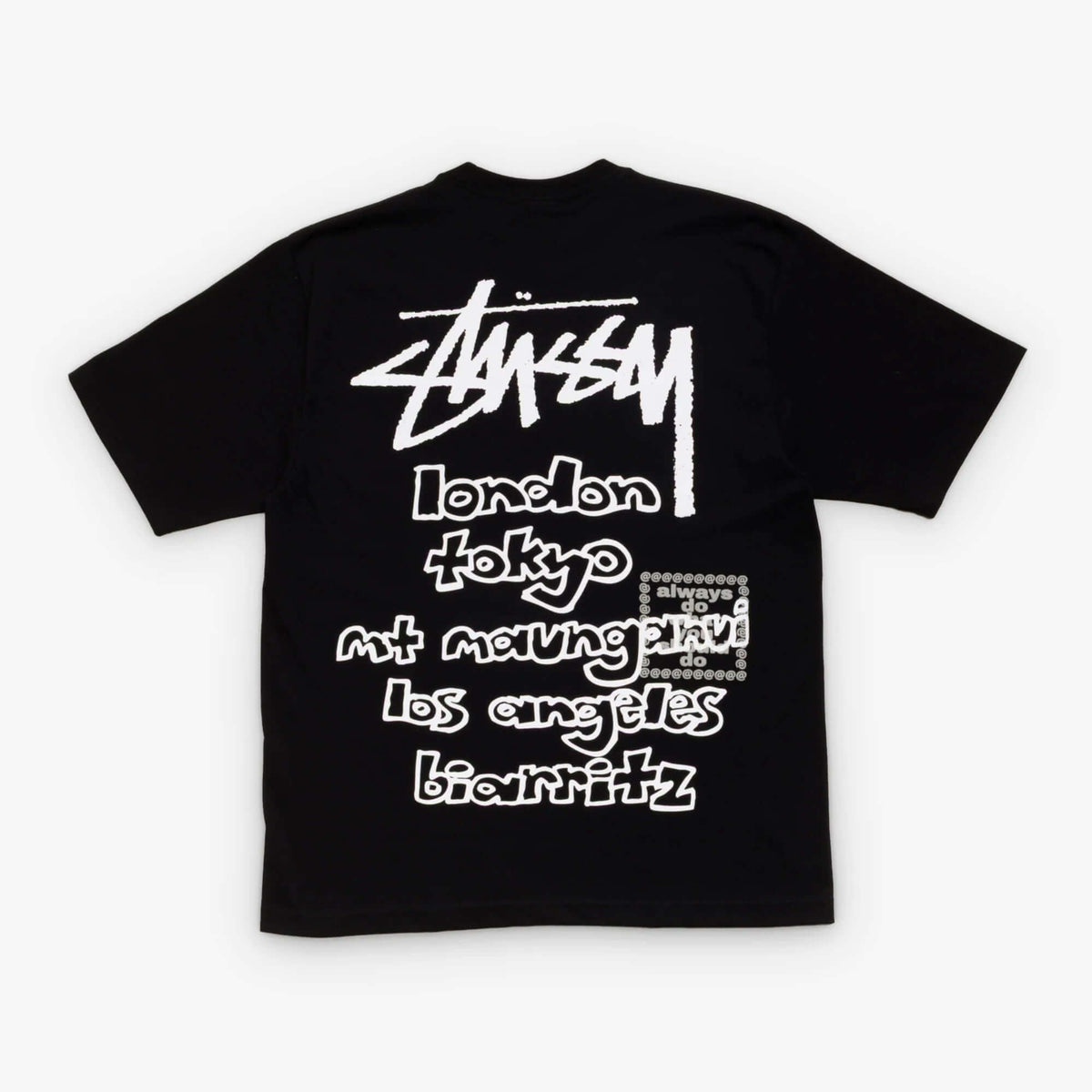 Stussy x Always Do What You Should Do World Tour Tee features city names on black fabric, showcasing the brand's global influence.