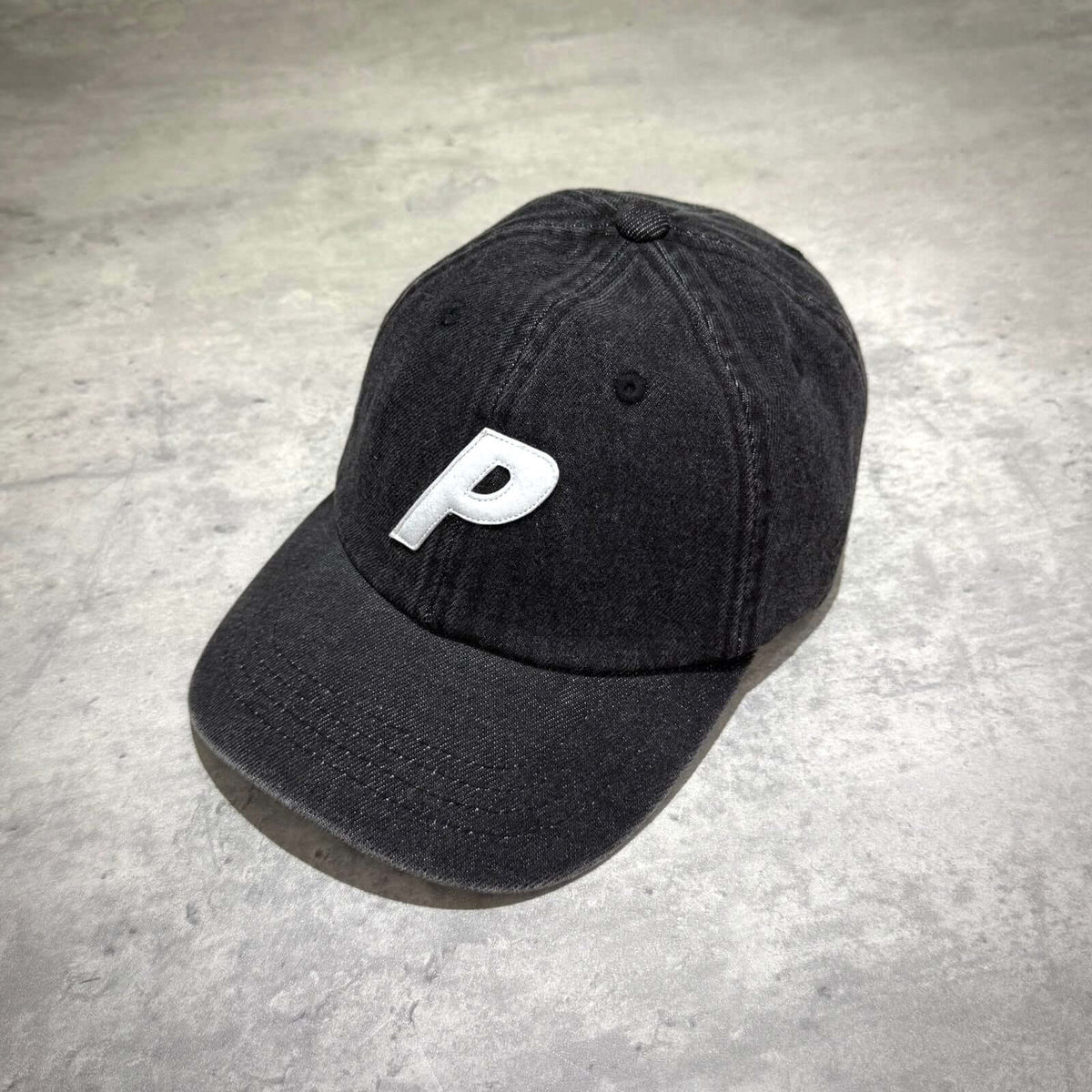 Palace Demin P 6 Panel - Black hat featuring a white "P" logo on the front, perfect for casual wear.