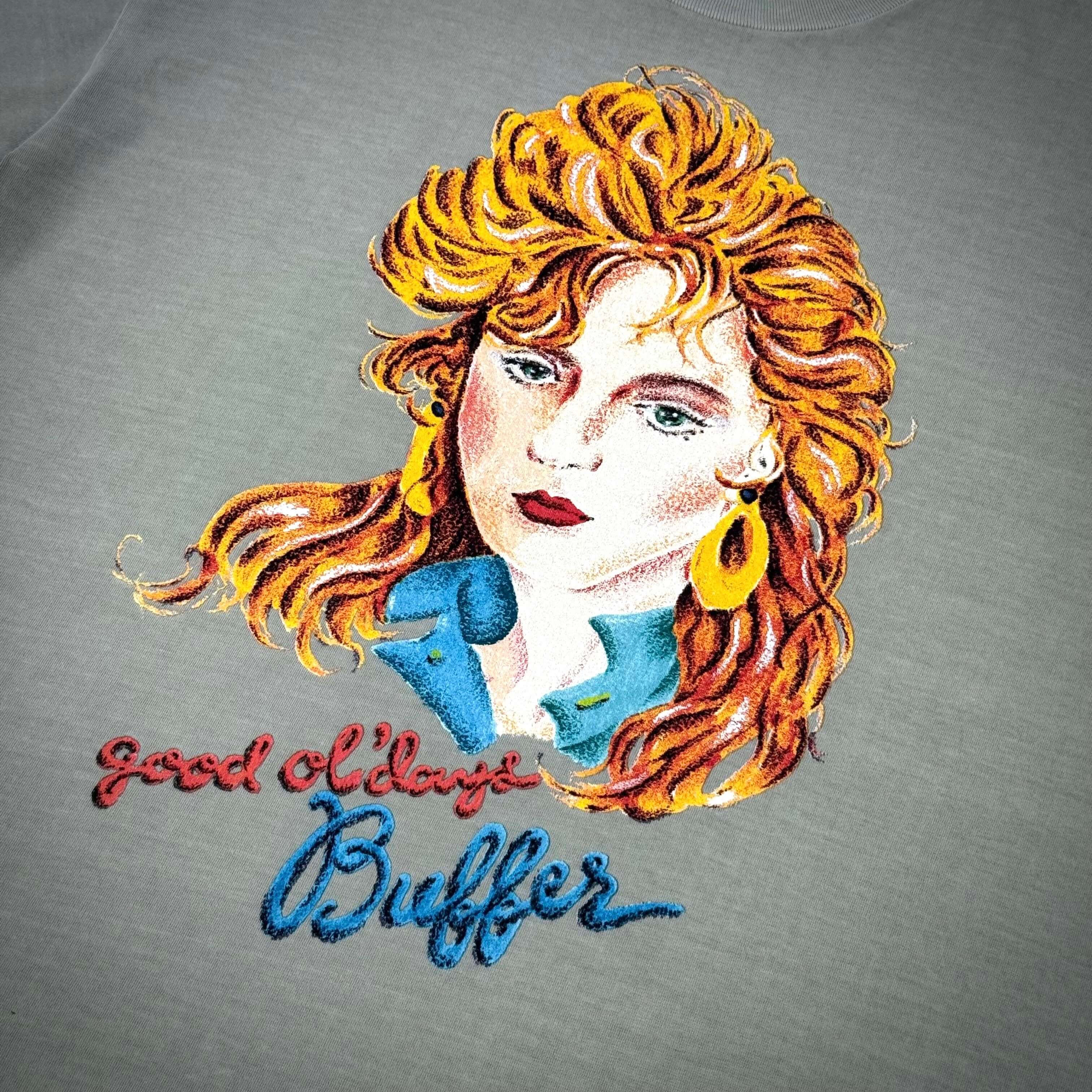 Embroidered design of a woman with a retro hairstyle on a gray tee featuring the words "good old days" and "Buffer."