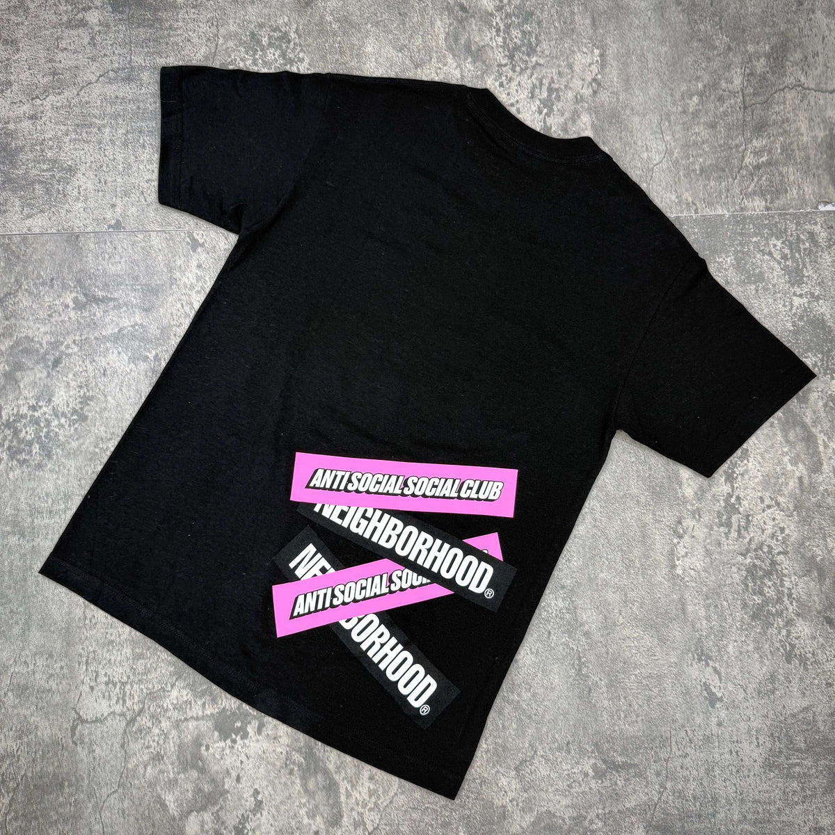 Anti Social Social Club x Neighborhood Stuck On You Tee featuring bold branding on the back design in black.