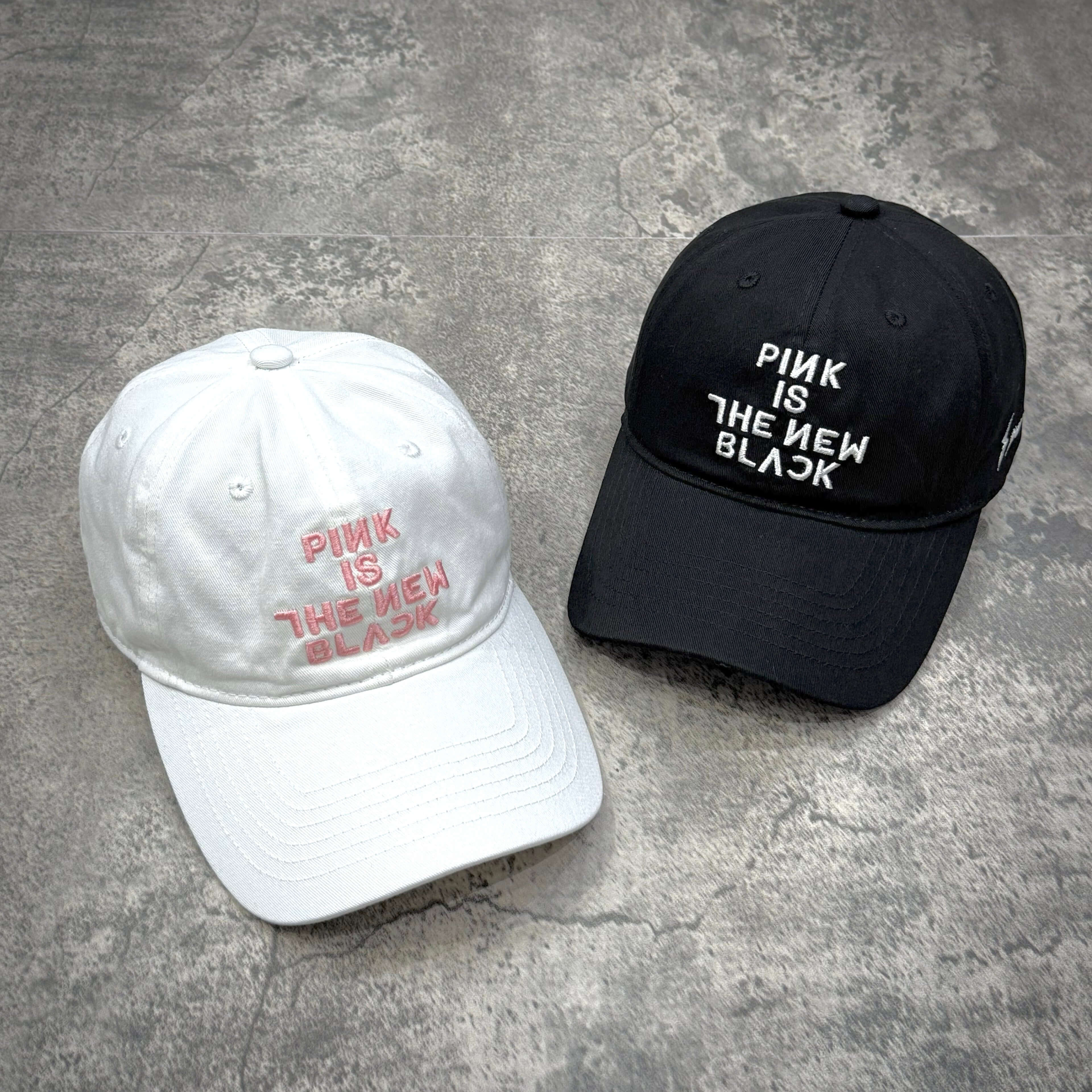 Fragment x Blackpink Cap featuring white and black colors with embroidered text 'PINK IS THE NEW BLACK'
