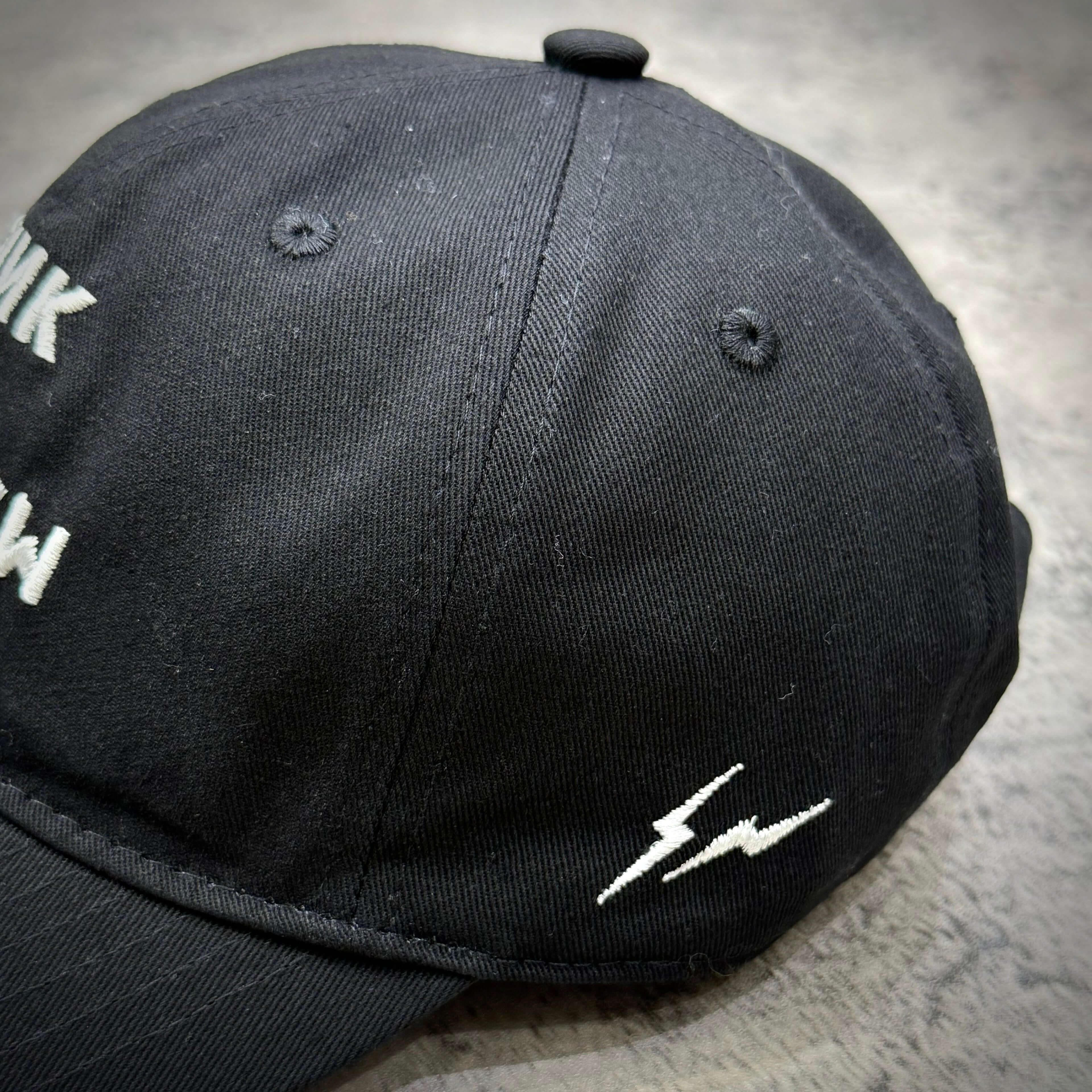 Fragment x Blackpink Cap featuring a black design with stylish embroidery and lightning bolt detail.