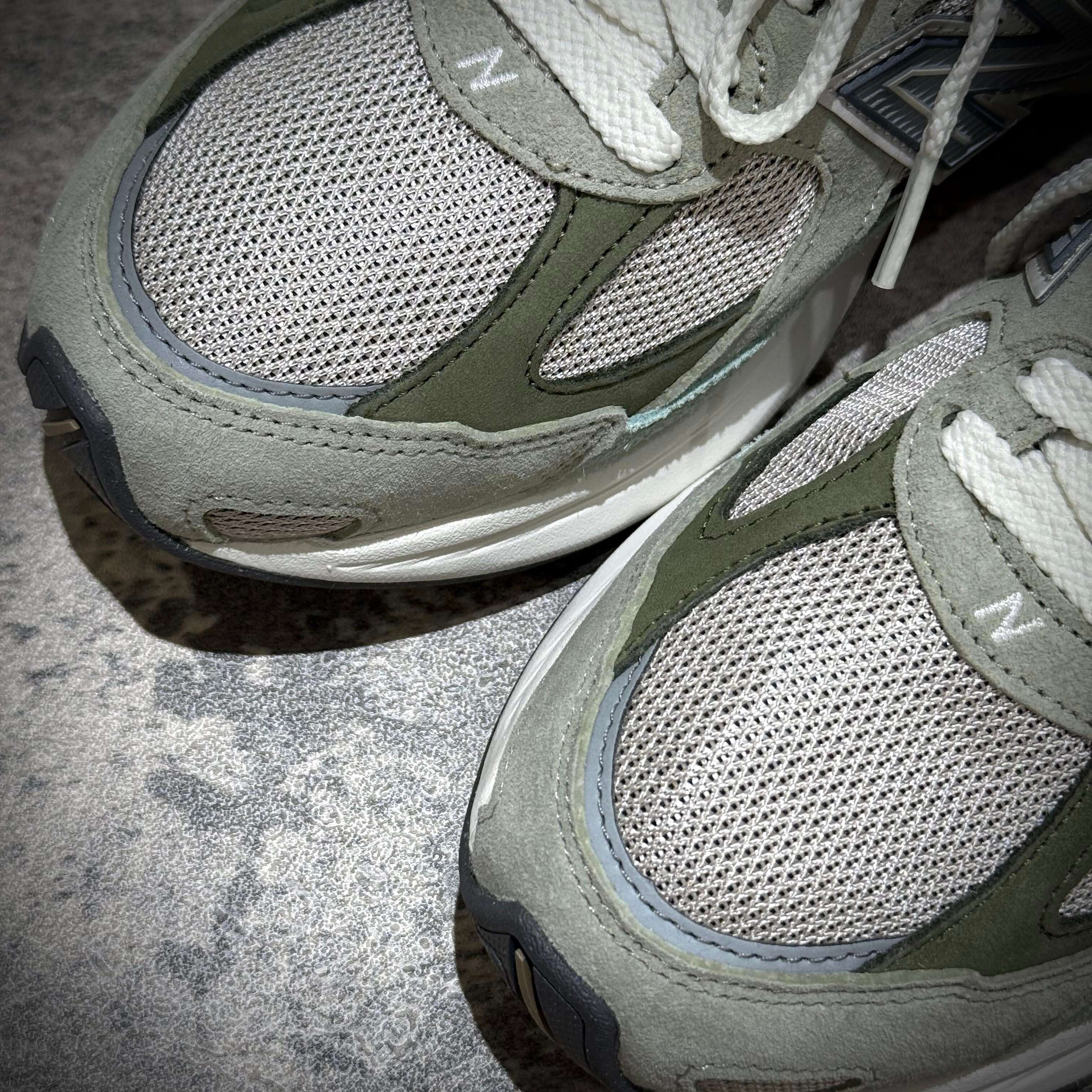 Close-up view of New Balance U20105K7 Wasabi Green sneakers highlighting the mesh and suede materials.