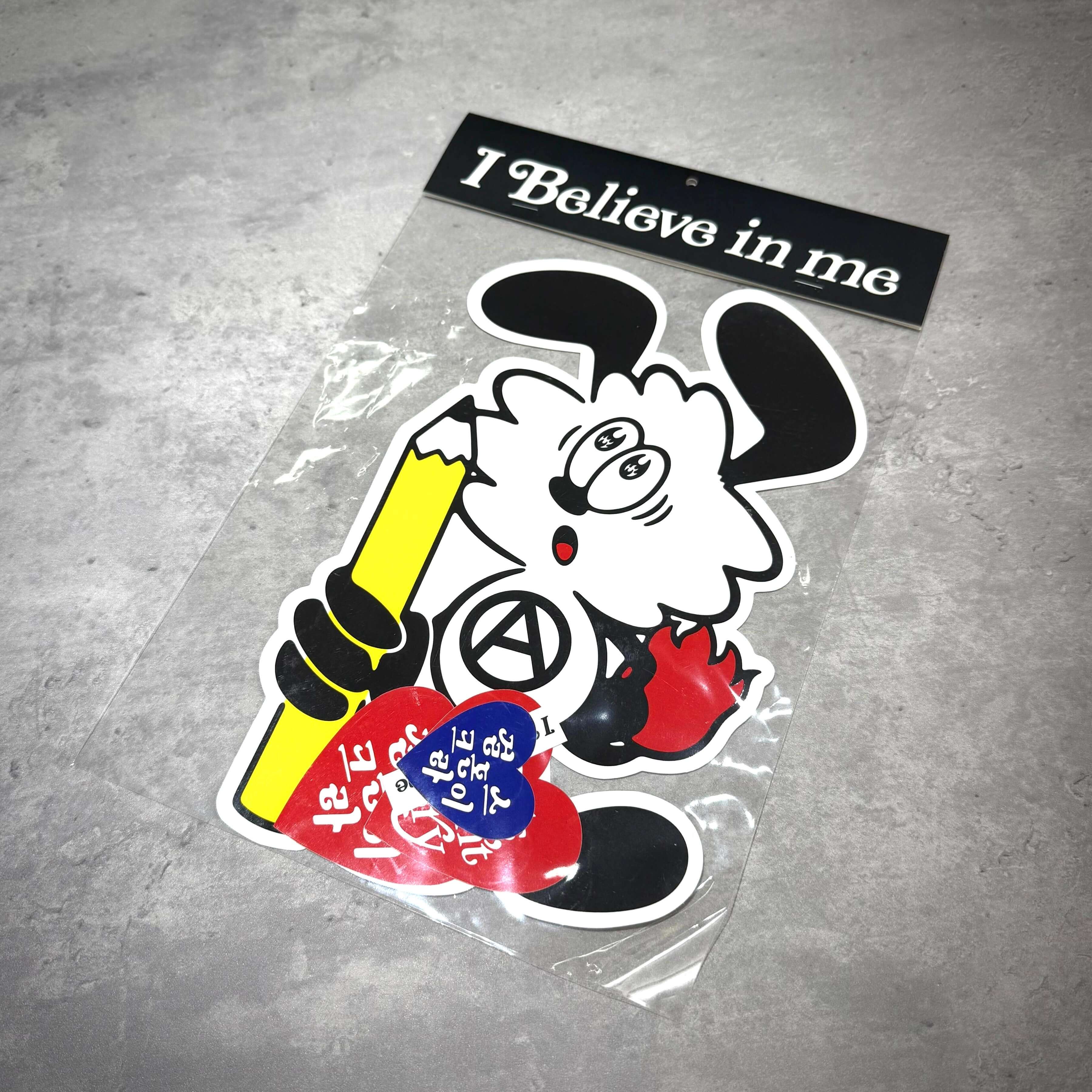 Verdy x Lottemuseum sticker featuring a playful character holding a pencil and heart-shaped stickers, encapsulating creativity.