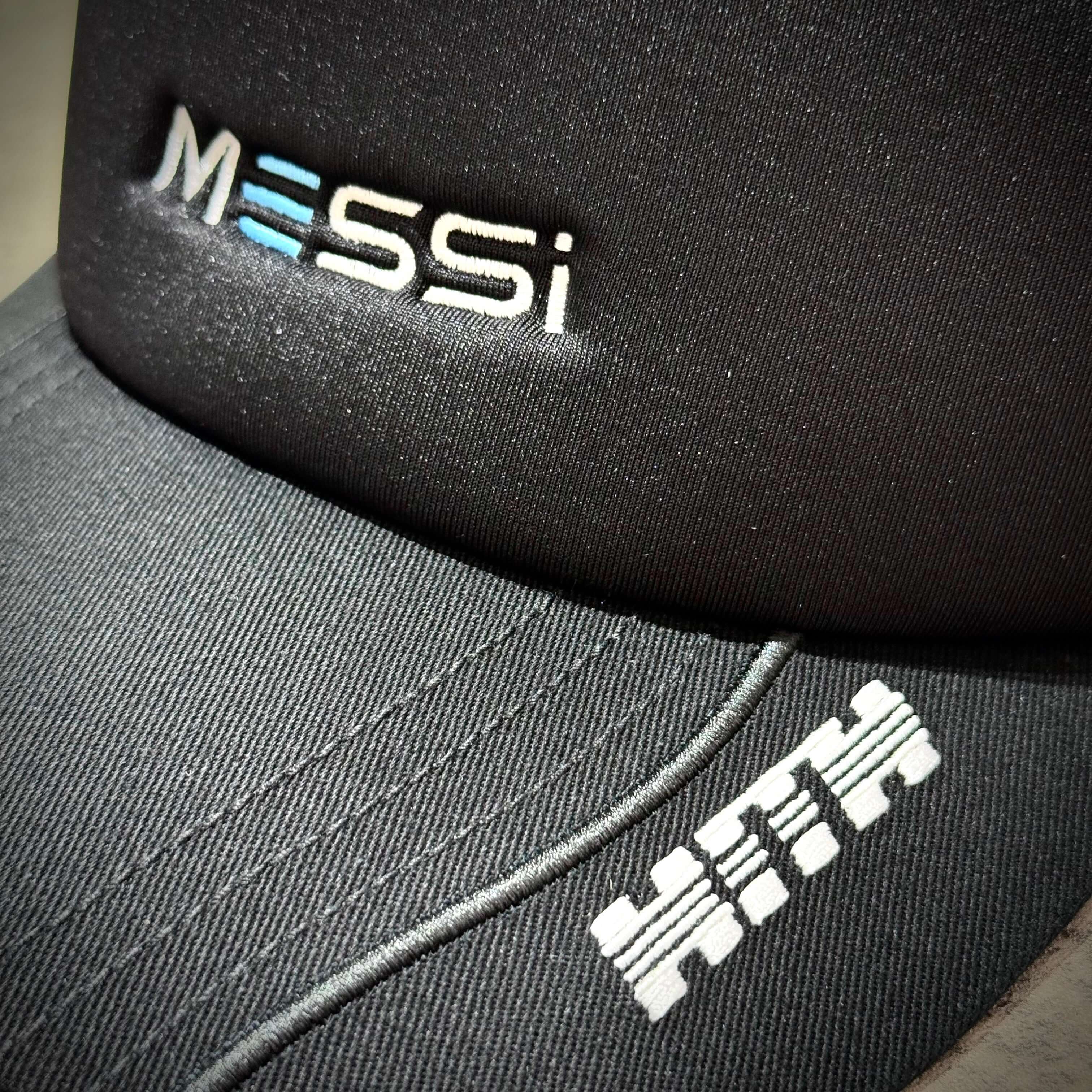 KITH x MESSI for adidas Football Trcuker Hat / 6 Panel Cap showing MESSi and KITH logo embroidery on black fabric.