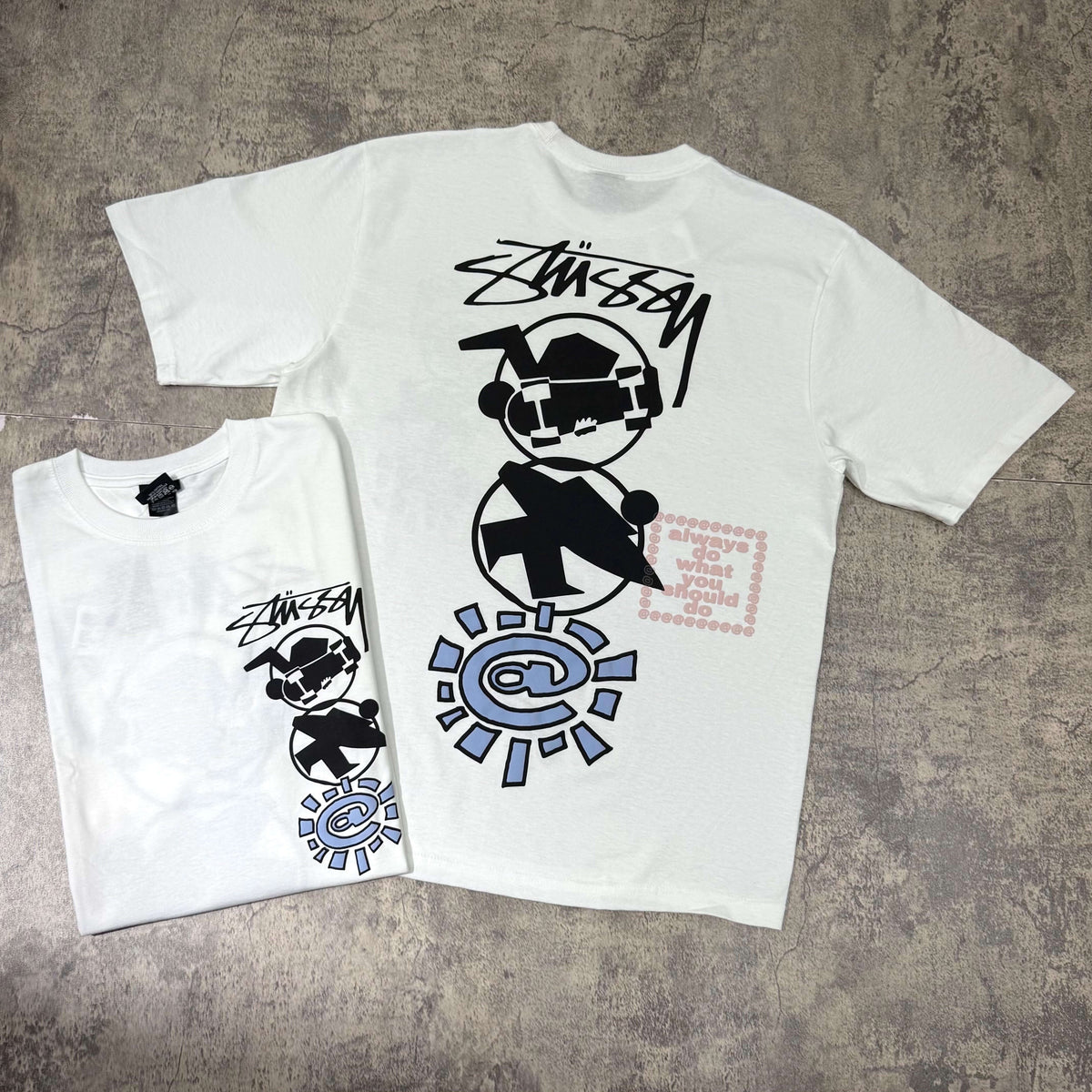 Stussy x Always Do What You Should Do Stack Tee featuring graffiti-style art on a white T-shirt.