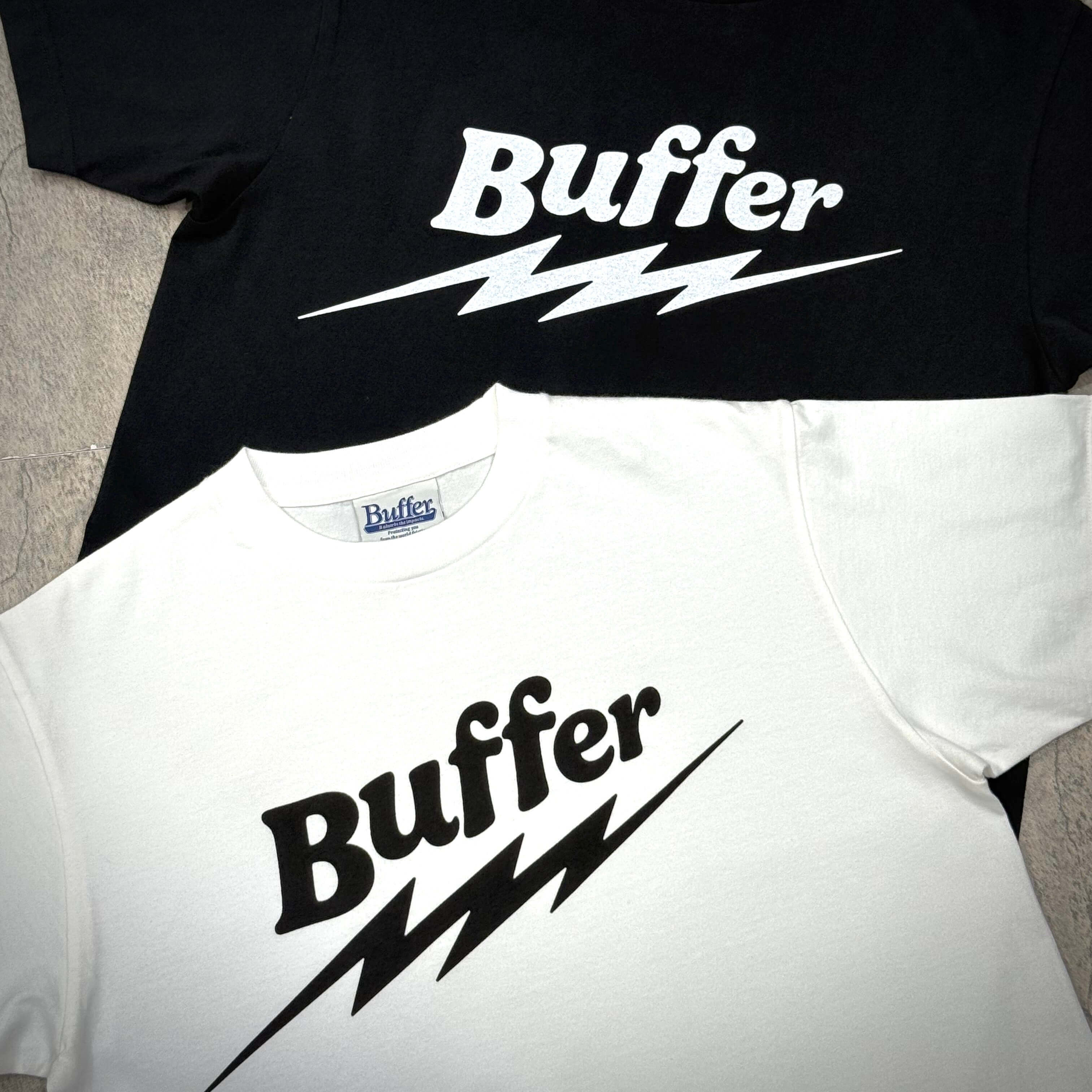 Two Buffer Lightning Wiz Tees in black and white, showcasing bold Buffer logo and lightning design.