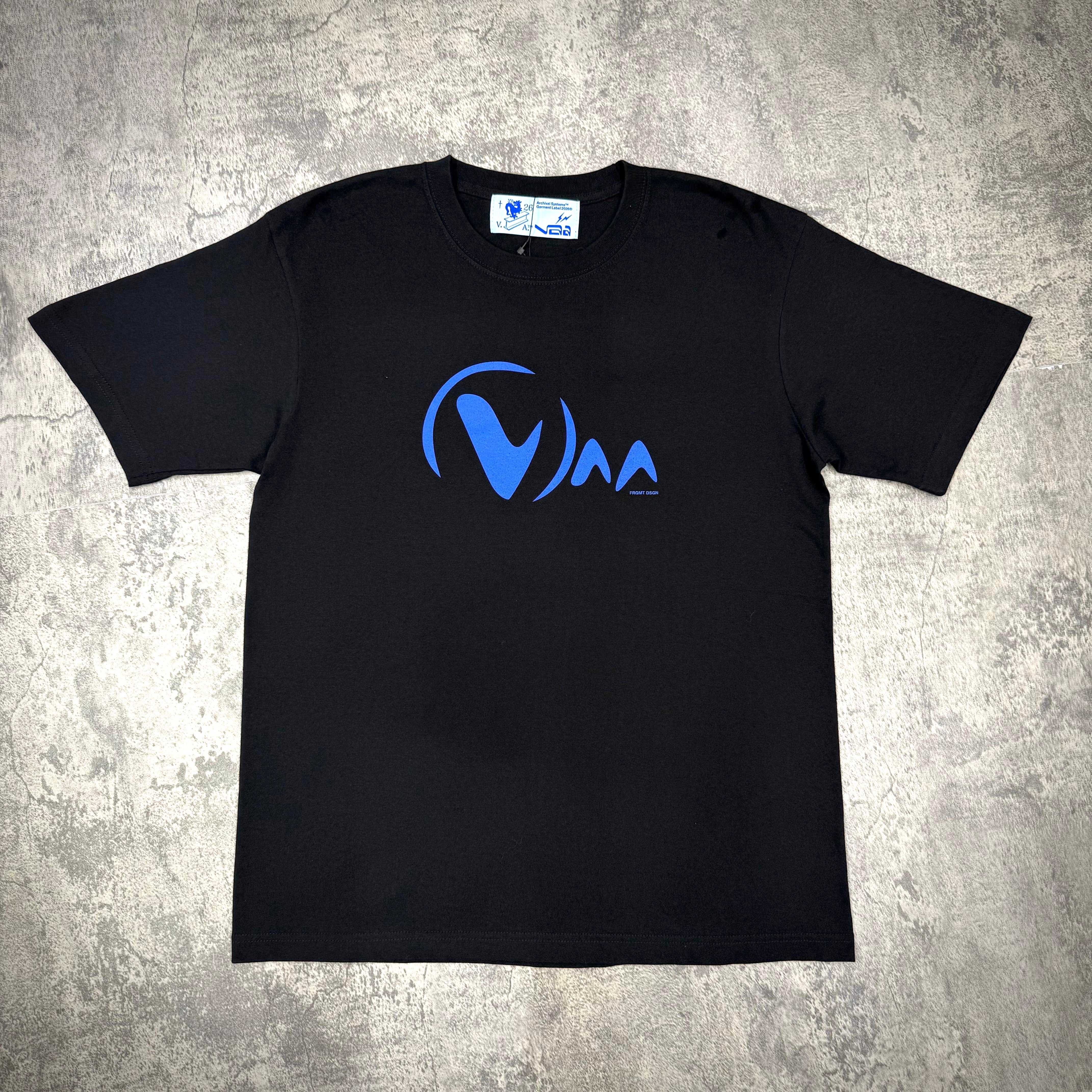 Fragment Design x Virgil Abloh Archive Logo Tee in black with blue graphic design on chest.