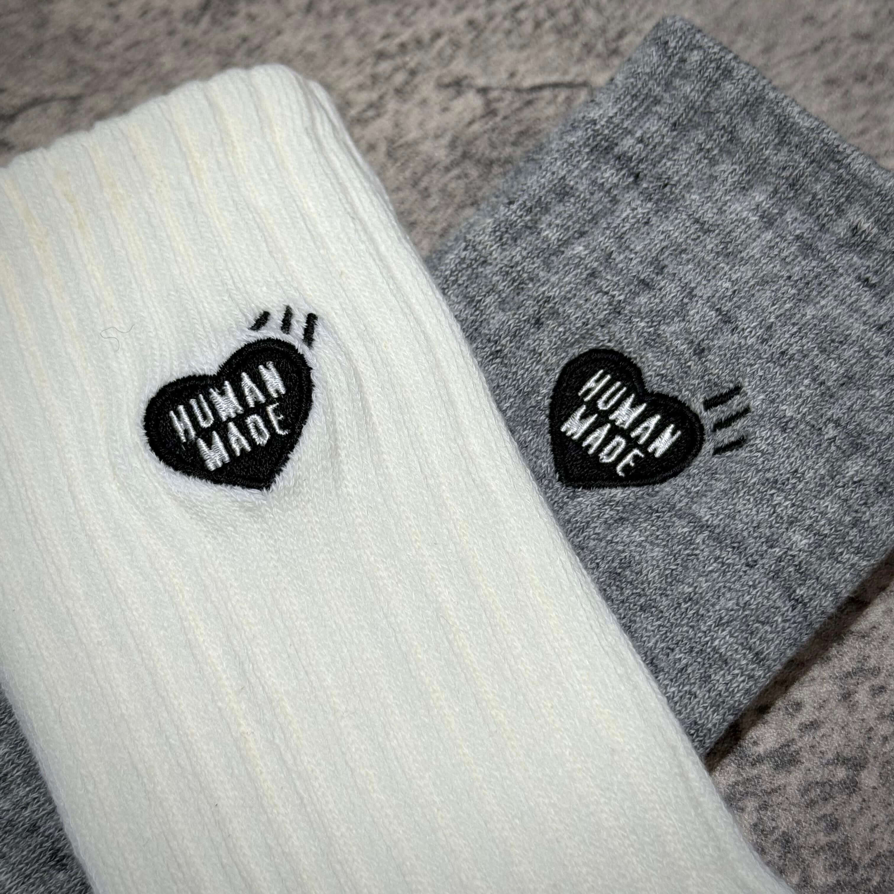 Human Made Pile Socks featuring a ribbed design in white and grey with heart logo detailing.
