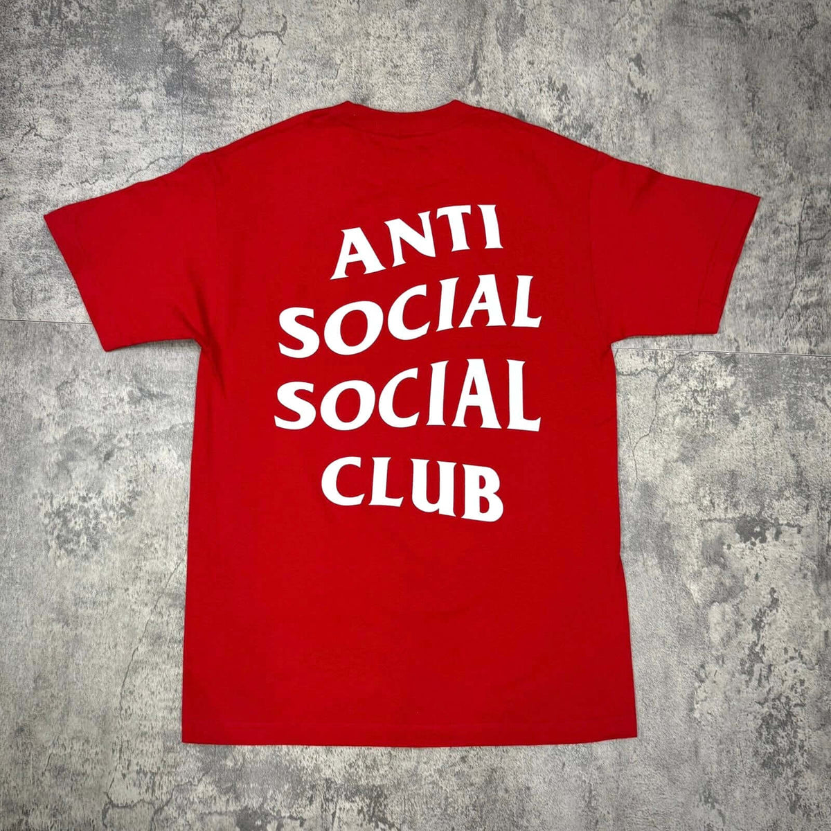 Anti Social Social Club Tokyo Tee - Red featuring bold white text on the back, showcasing streetwear style.