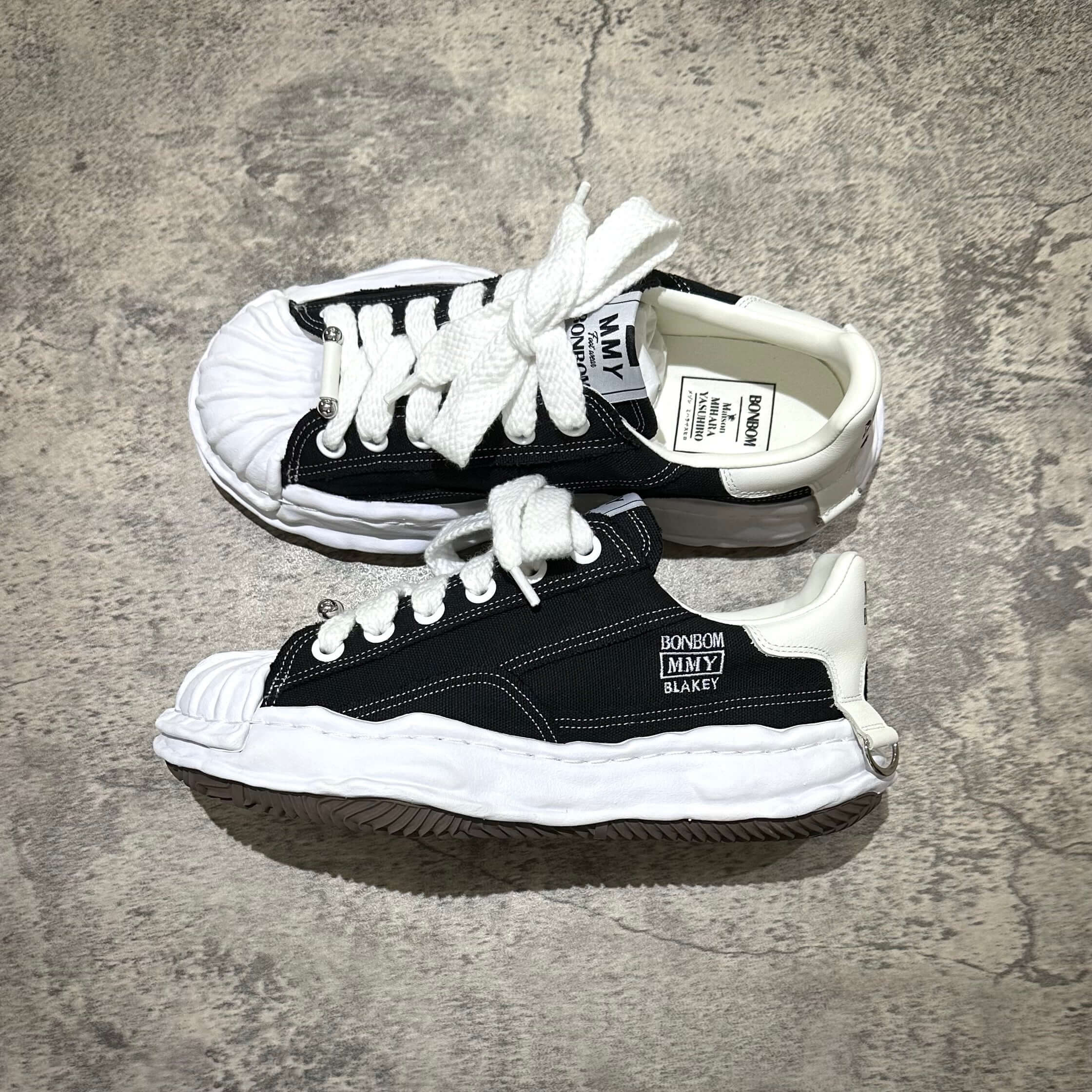 BONBOM x MMY BLAKEY OG Canvas - Black sneaker featuring a unique design and white laces.