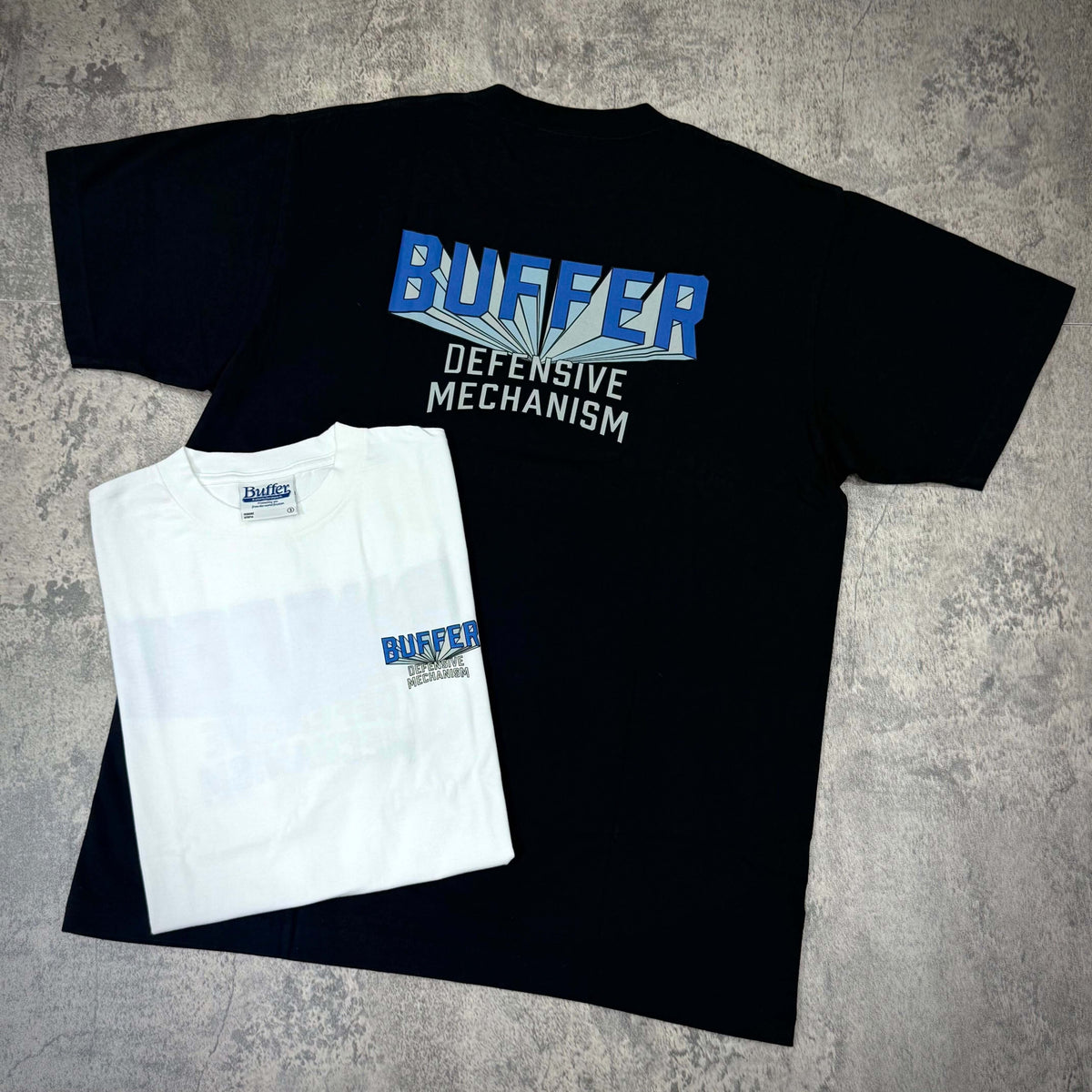 Buffer Gravity Tee - Black / White, featuring bold graphics and front logo, showcasing brand's unique design.