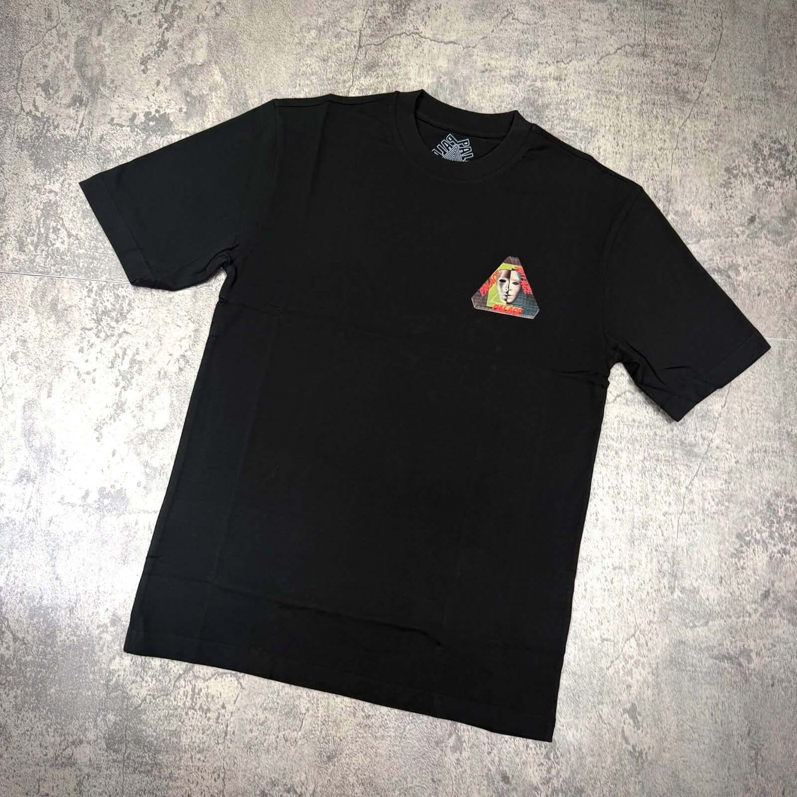 Palace Tri-Bury Tee - Black featuring a graphic triangle logo on the left chest area.