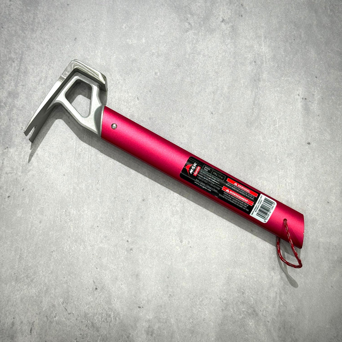 Supreme x MSR Camp Hammer - Red, a lightweight stake hammer with stainless steel head and bottle opener feature.