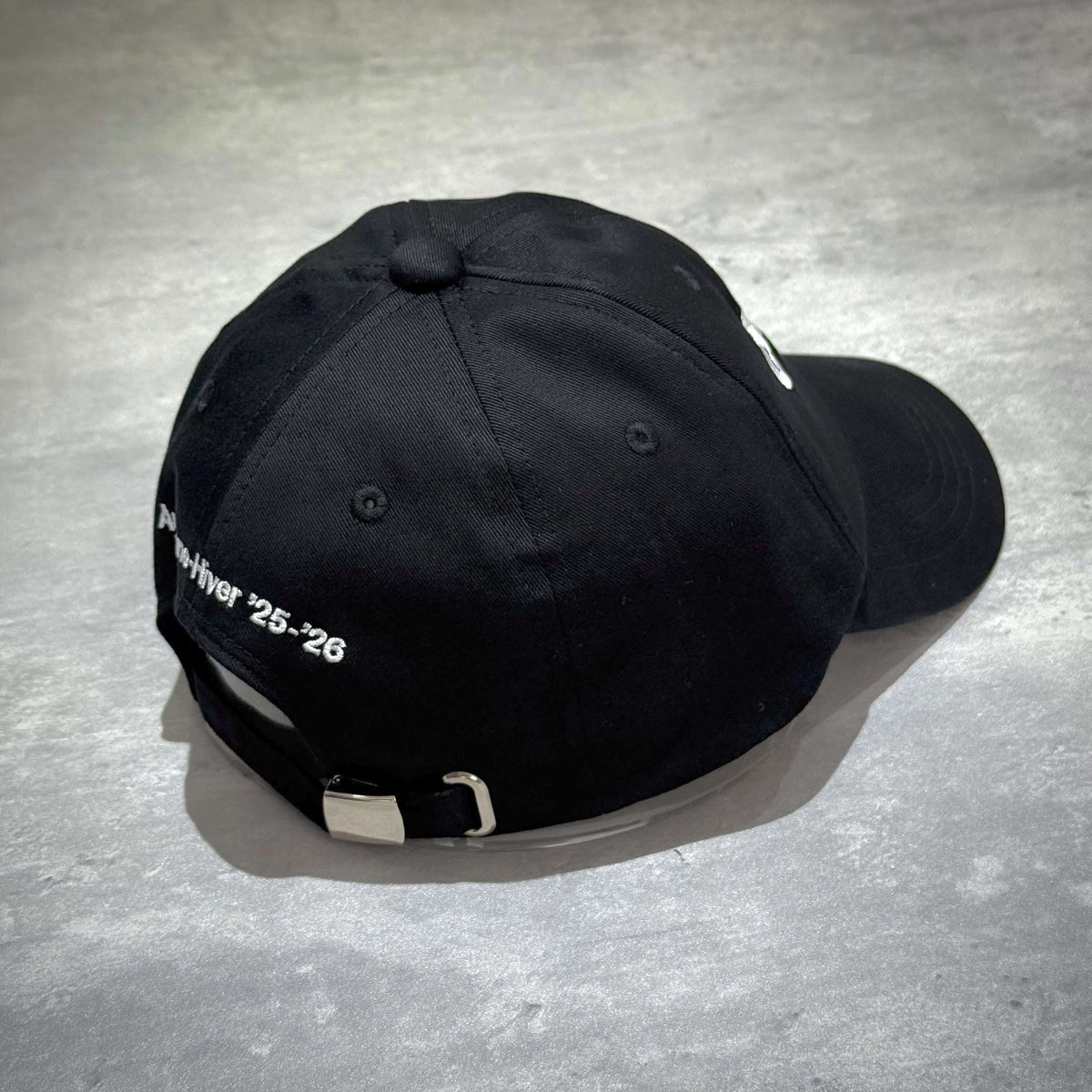 CDG x G-DRAGON Ubermensch Classic Cap showcasing the back view with embroidered details, perfect for urban fashion.