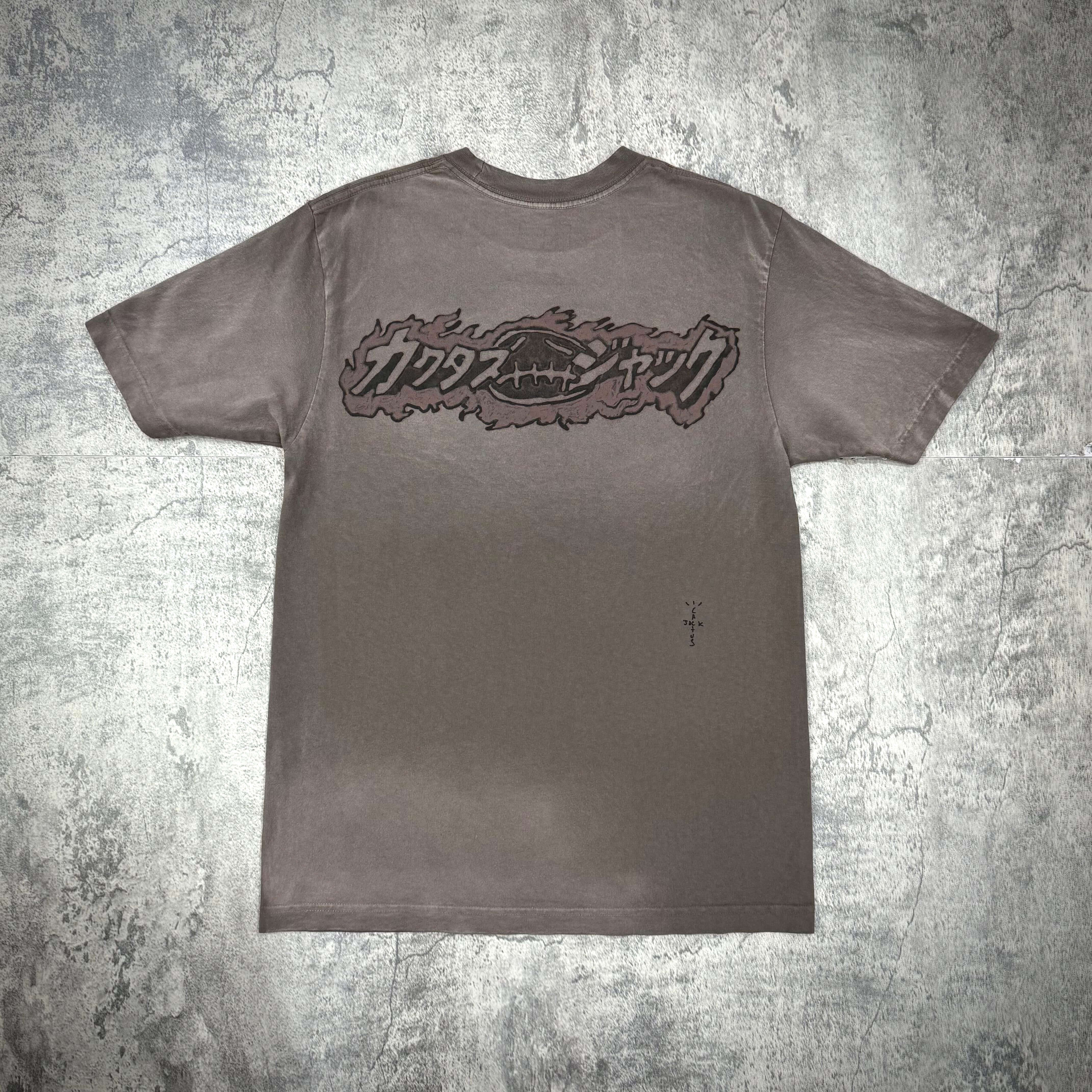 Cactus Jack x Takashi Murakami Melted Utopia Dream Tee back design featuring a bold logo on a grey background.