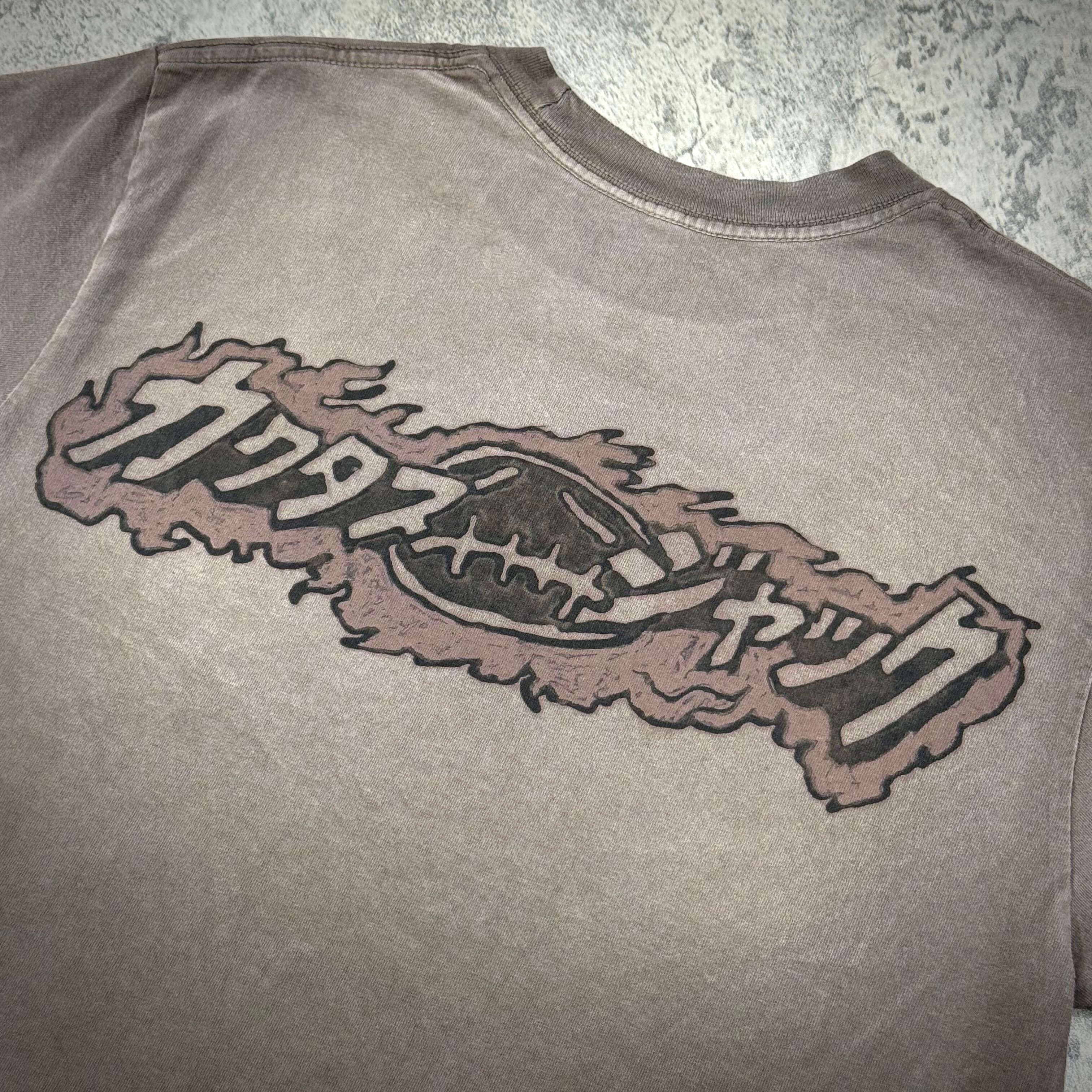 Cactus Jack x Takashi Murakami Melted Utopia Dream Tee showing the unique logo design on the back of the shirt.