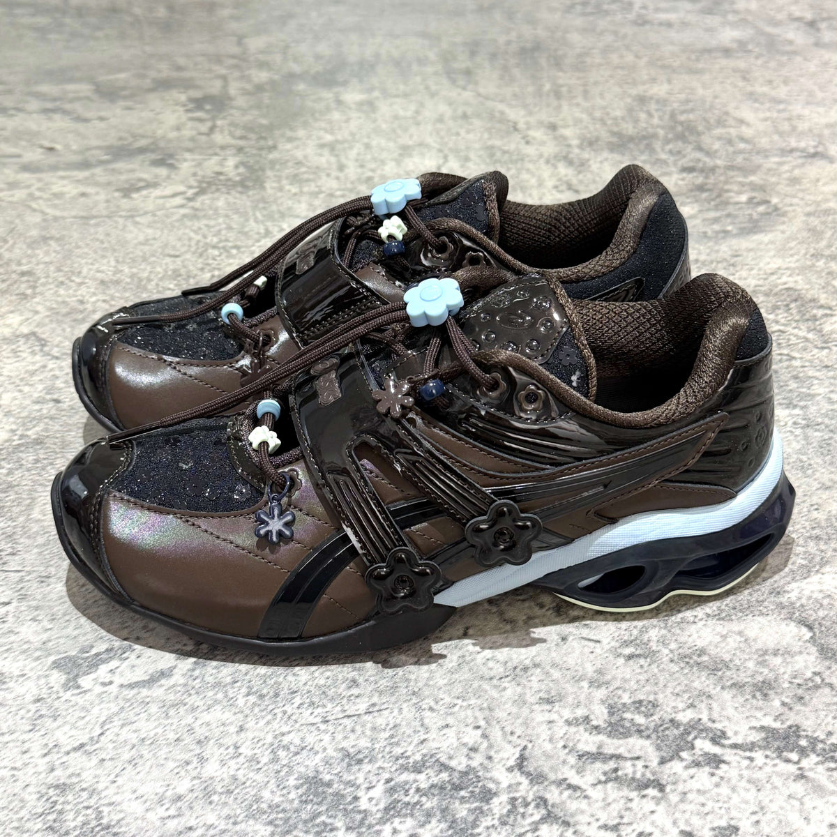 Cecilie Bahnsen x Asics Gel-Kinetic FR - Black Coffee 1203B171-001 stylish sneakers featuring unique floral details.