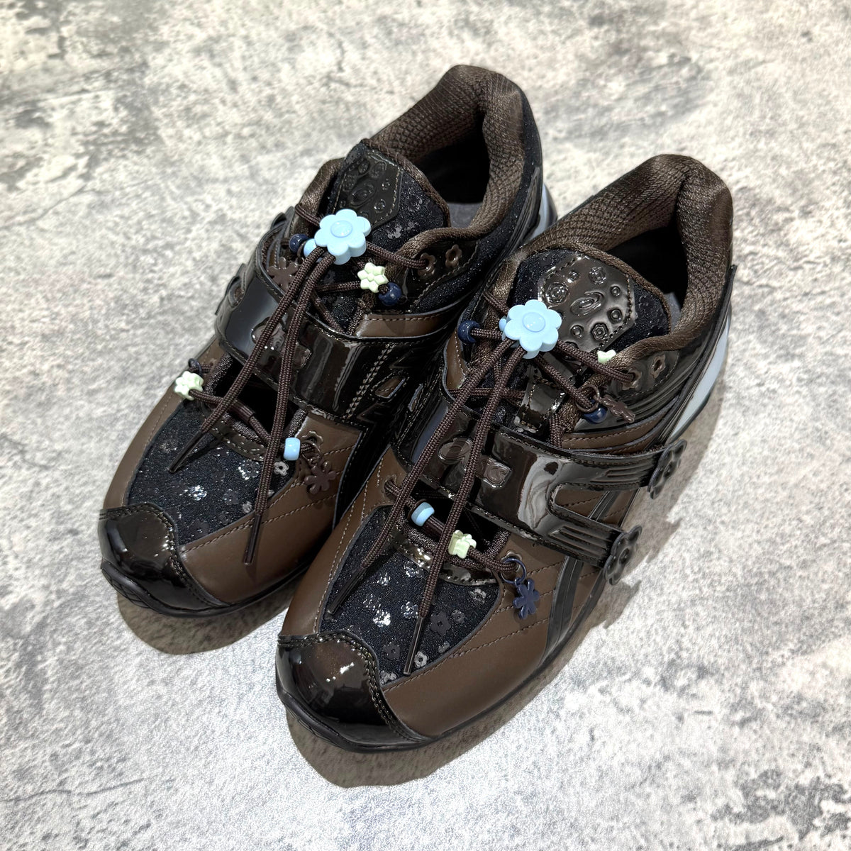 Cecilie Bahnsen x Asics Gel-Kinetic FR - Black Coffee 1203B171-001 stylish sneakers with unique floral details.