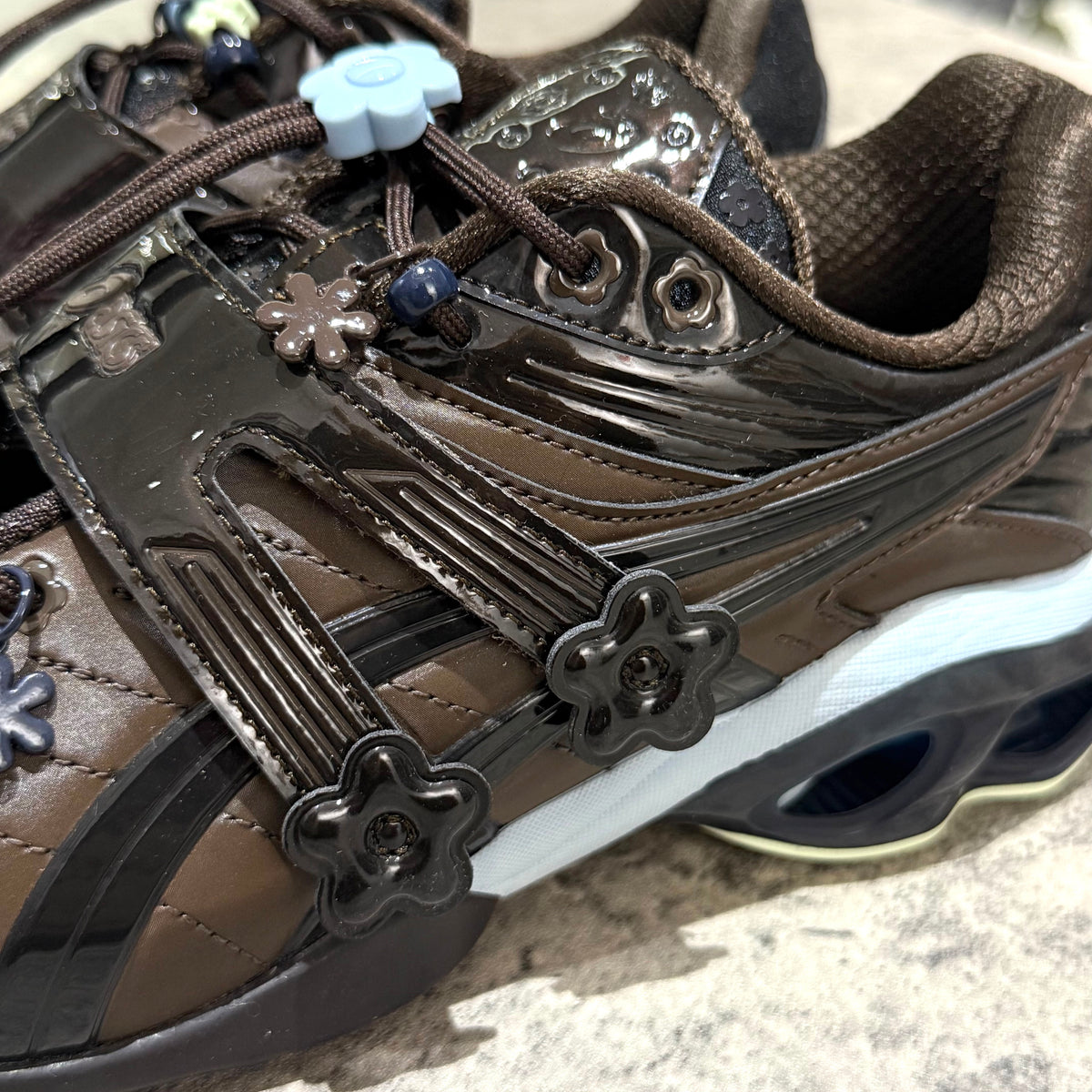 Cecilie Bahnsen x Asics Gel-Kinetic FR - Black Coffee 1203B171-001 close-up showcasing decorative details and color