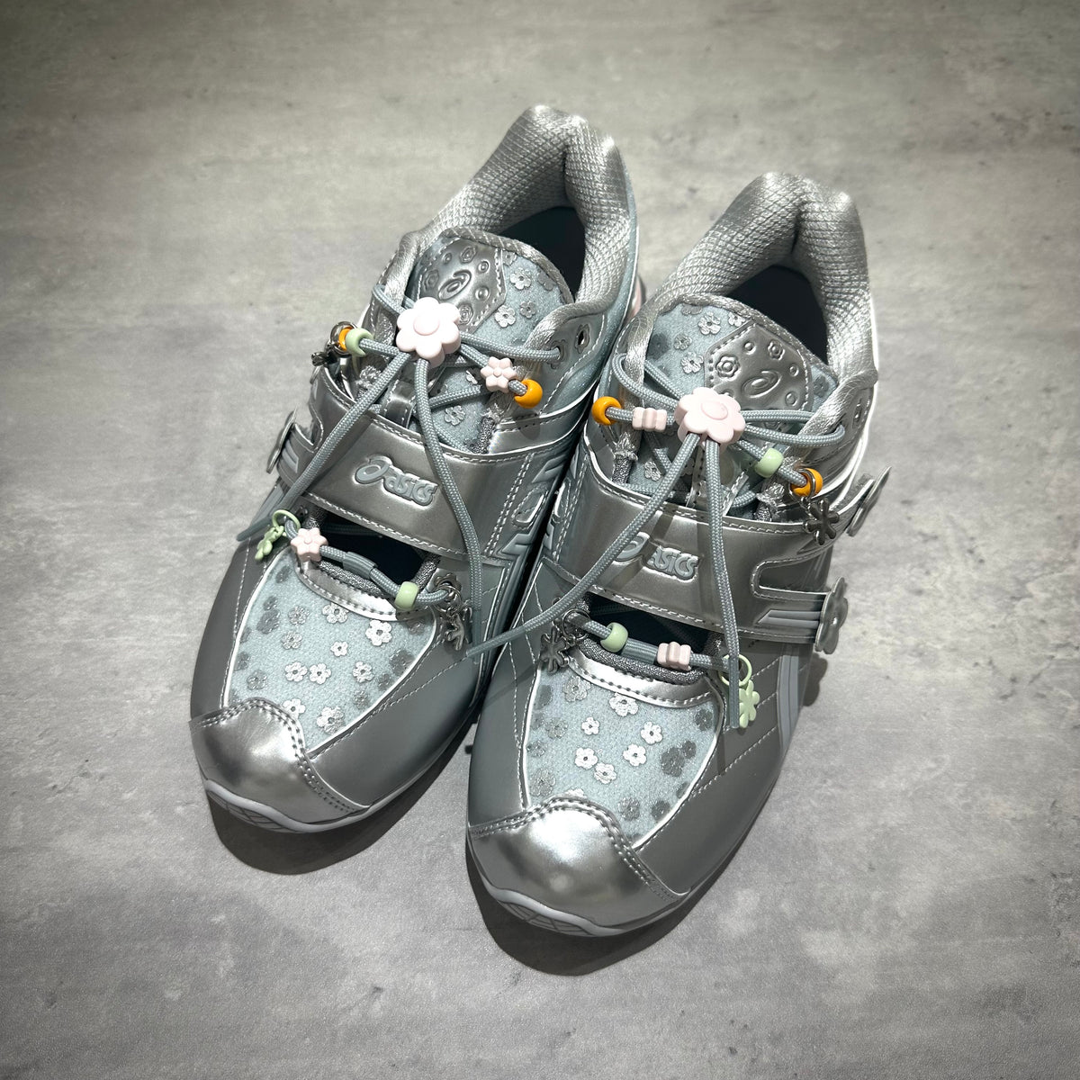 Cecilie Bahnsen x Asics Gel-Kinetic FR - Pure Silver 1203B171-020 design with floral accents and reflective finish.