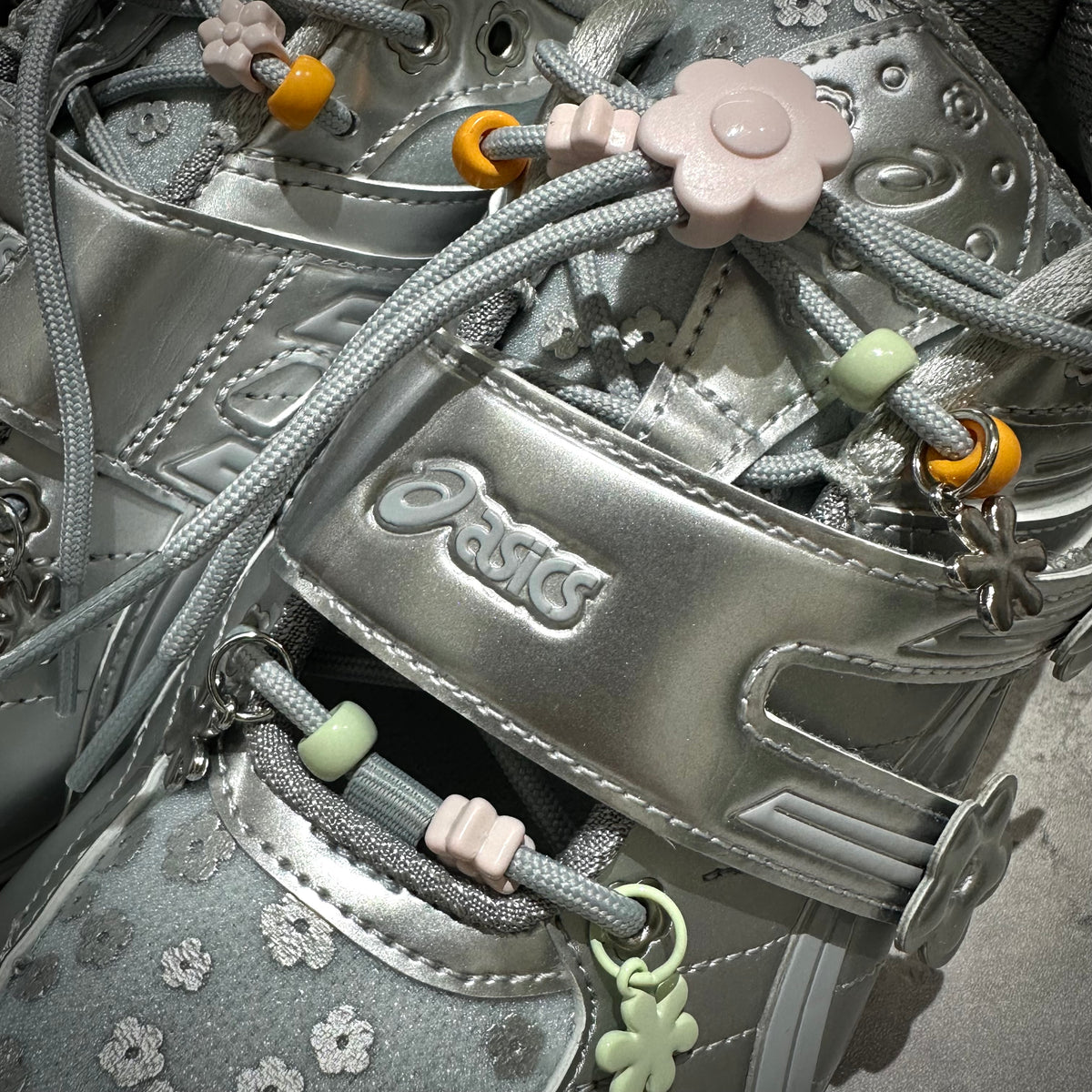 Cecilie Bahnsen x Asics Gel-Kinetic FR - Pure Silver 1203B171-020 featuring floral embellishments and silver accents.