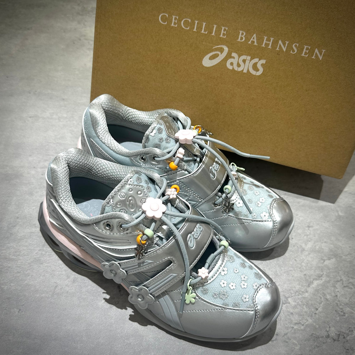 Cecilie Bahnsen x Asics Gel-Kinetic FR - Pure Silver 1203B171-020 stylish sneakers displayed with box.