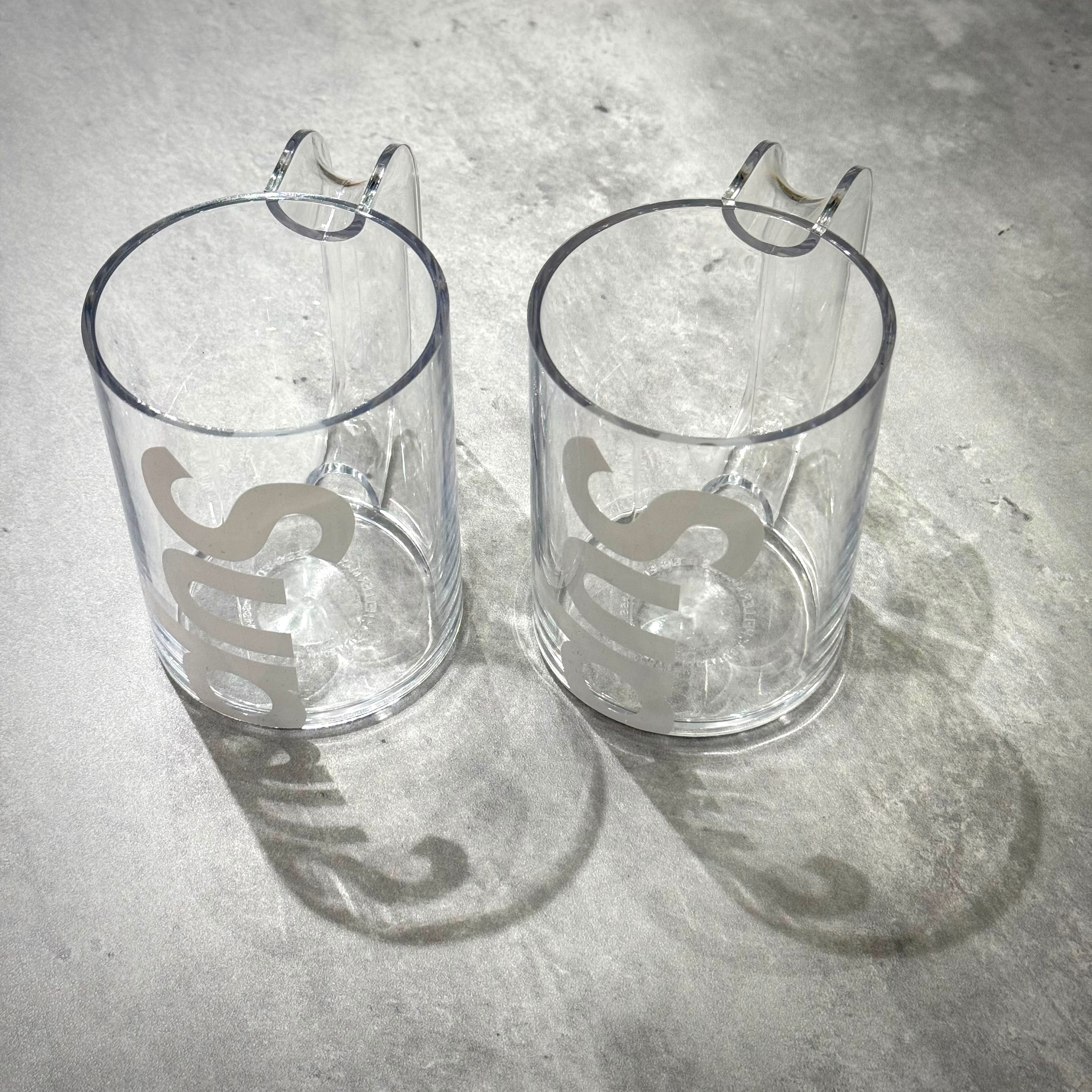 Supreme Heller Mugs (Set of 2) - Clear, transparent mugs featuring unique handle design and logo
