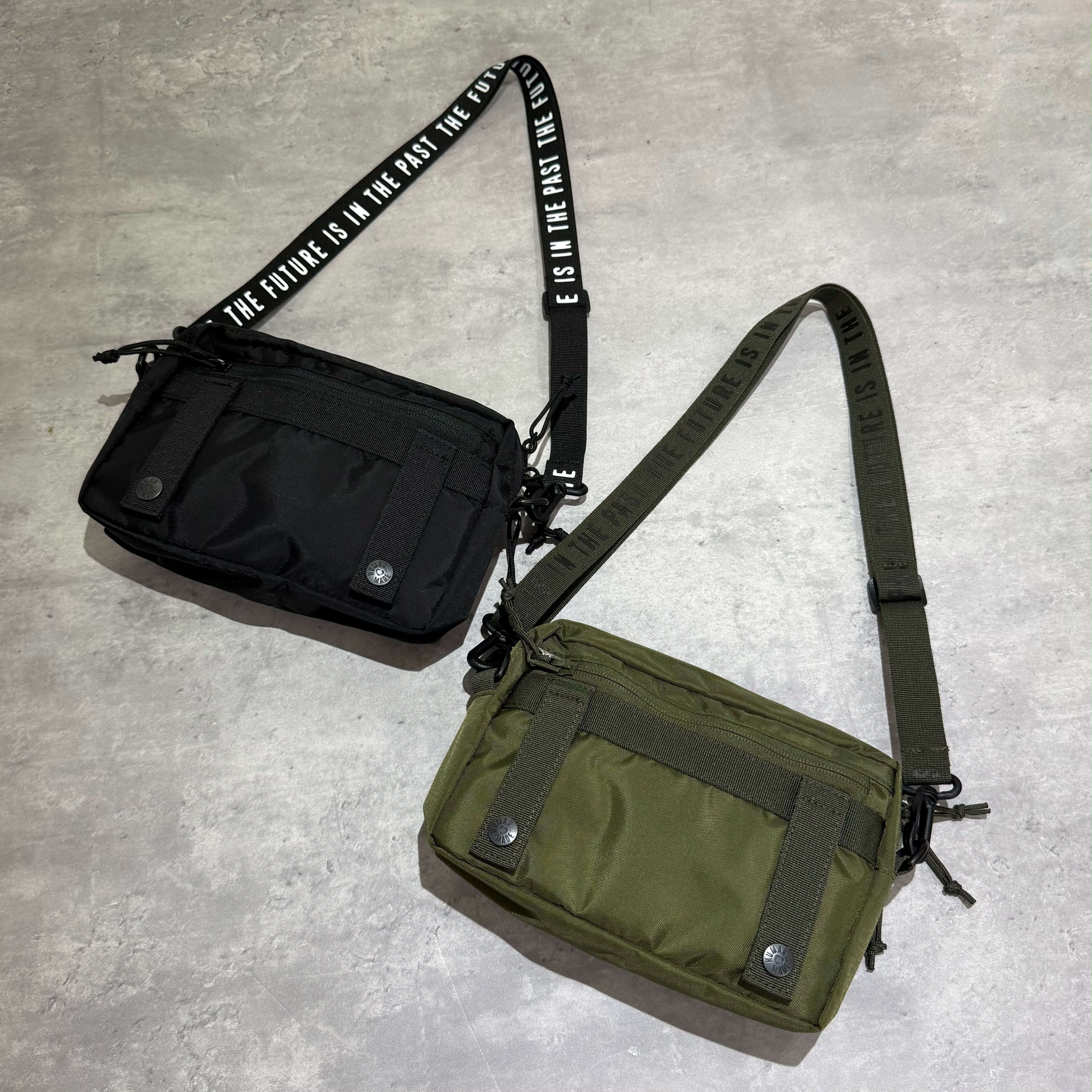 Human Made Military Pouch featuring black and green color options on a grey background.