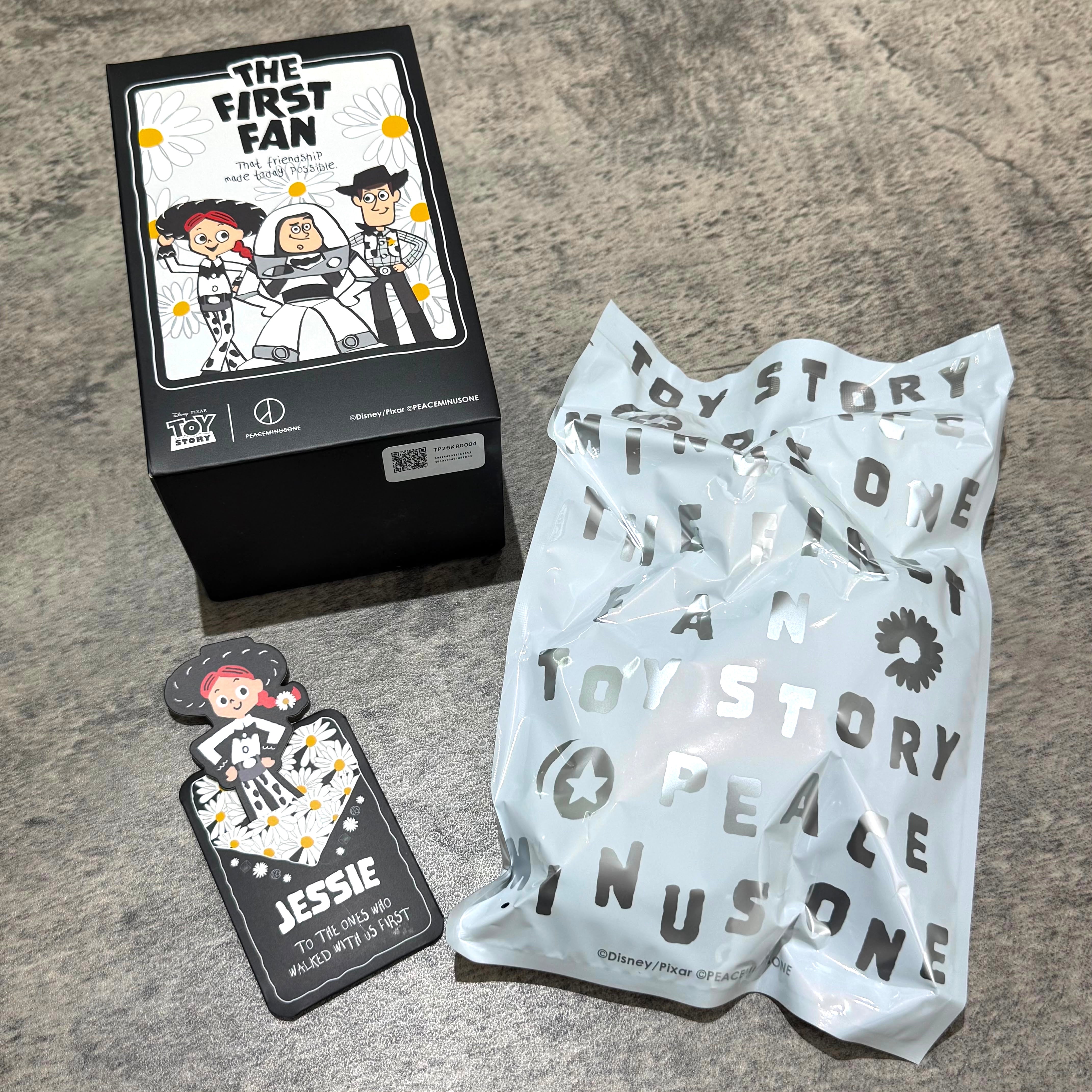 PEACEMINUSONE x Toy Story The First Fan - Blind Box Plush Key Ring (Opened) packaging and tag on table.