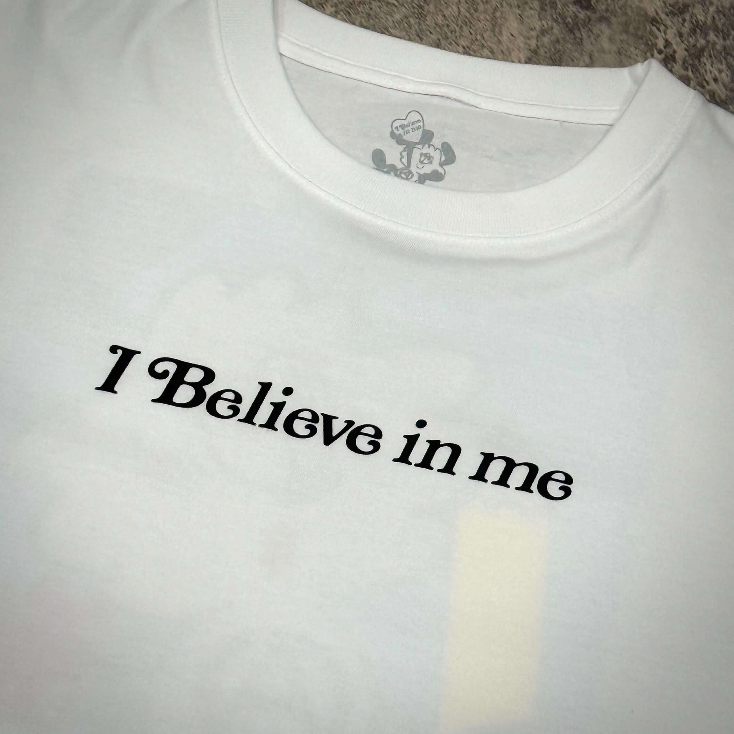 Verdy x Lottemuseum Tee #4 featuring "I Believe in me" bold print on a white shirt.
